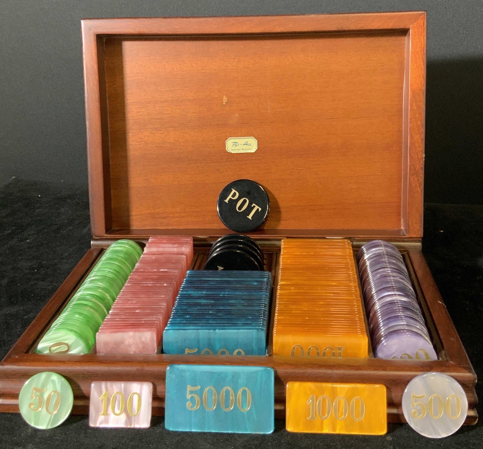 Vintage Boxed Poker Chip Set: Dark brown wooden box containing poker chip set. Interior of box sticker reads: Bi-Ass Settimo Milanese. Green, pink, black, blue, purple, and orange chips. Appears to be a complete set. Box approx. 1