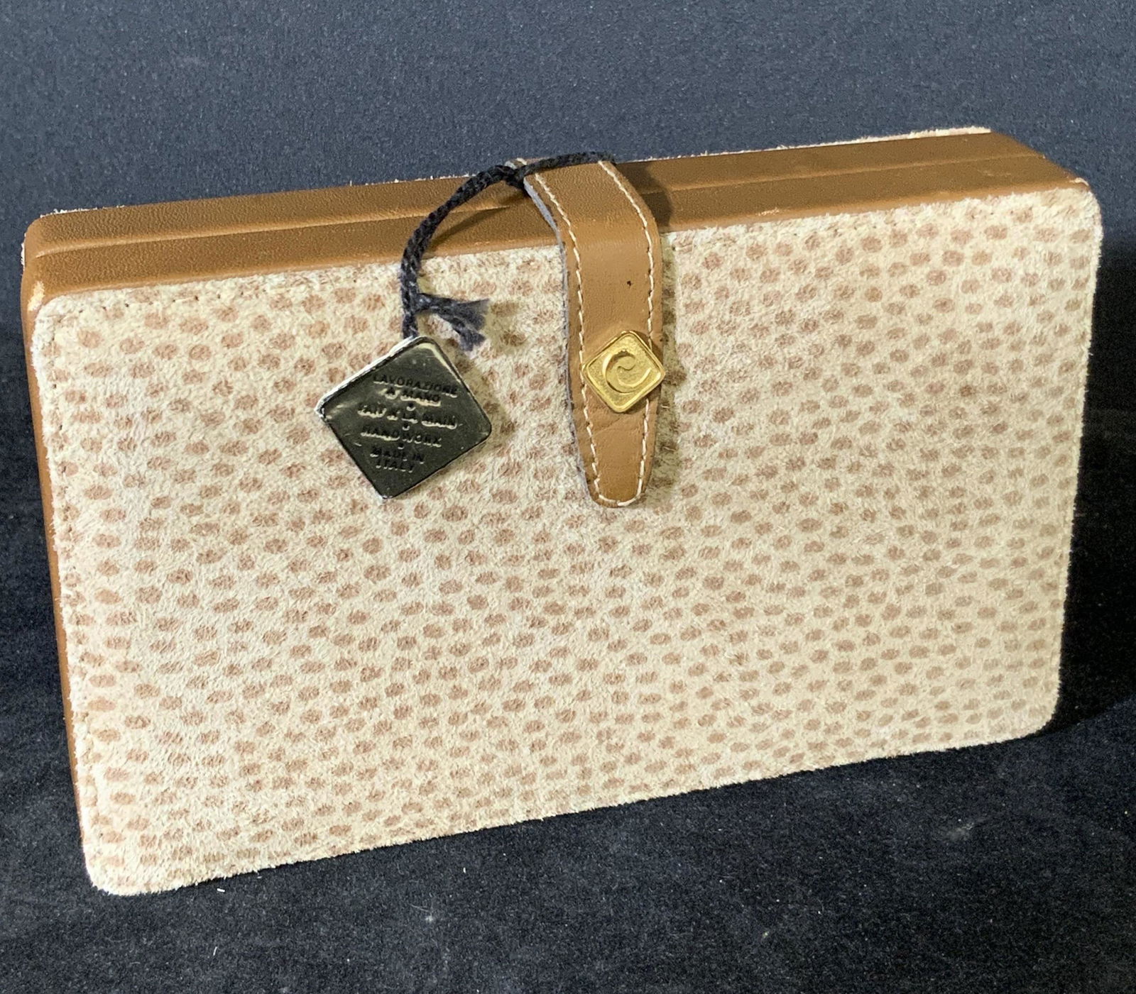 Manicure Set in Leather & Suede Casing, Italy: Stainless steel manicure set in a leather and suede case. Set still has tags on it. Case is brown spotted with gold toned hardware, snap closure. Never used. New old stock. Outer tag reads: Made in It