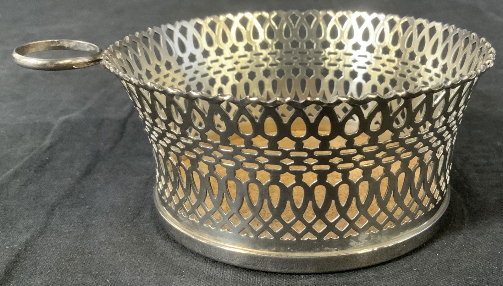 NAPIER Silver Plate Wine Bottle Coaster: Napier Silver Plate Wine Bottle Holder, inscription to base reads ‘Napier’, pierced metal design, measures 2 1/8 x 5 1/4 inches at widest point, in good condition, Napier, silver plate, wine holde