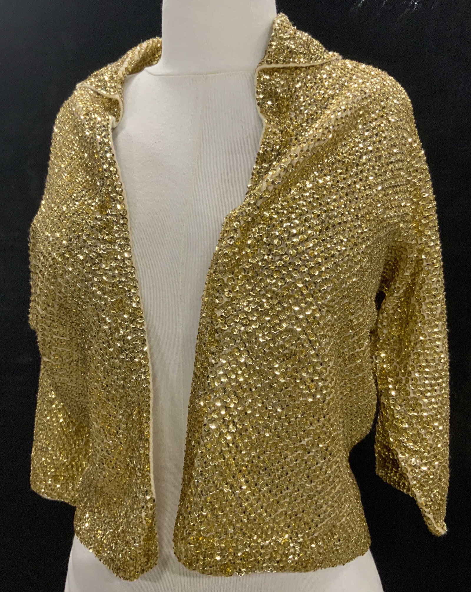 Glittery Vintage Gold Sequin Fashion Jacket: Size Small. Fill sequined. Interior knit, possibly cashmere through sleeves. 3/4 sleeves. Stops at waist. Ladies vintage fashion, c. 1970s fashion Jacket, Size Small Gold Sequin, Cashmere Knitwear, Ca