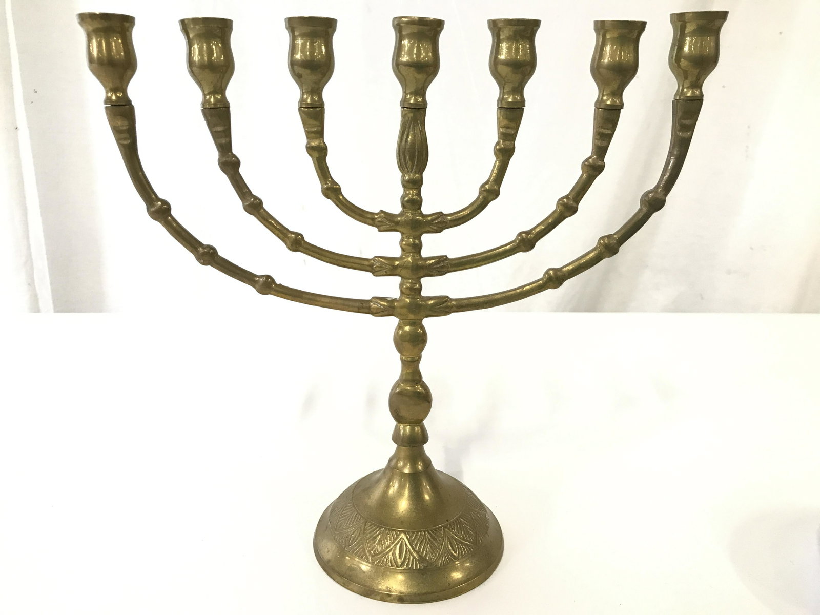 Vintage Gold Toned Brass Menorah: Menorah is gold toned and brass. Piece appears to be vintage. Measures approximately 9 inches tall and wide 3.5 inches deep. Menorah, Judaica menorah, Hebraica, Judaica, brass menorah, vintage menorah