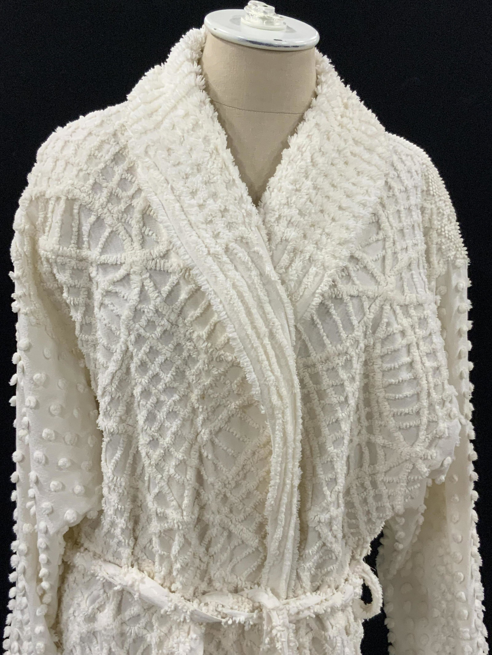 Vintage MARYLIN WOLF Designs Robe w/ Original Tag: White robe with tie waist. Composed of various fabrics, thick material. Some small white pompoms adorn sleeves. Shoulder pads. Two exterior pockets. Size approx. Large, tag reads one size fits all. Le