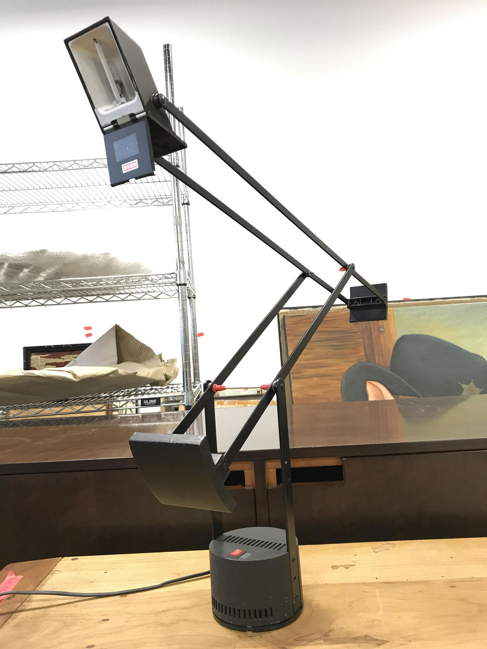 ARTEMIDE Black Metal Desk Lamp: Base of lamp has tag which reads ARTEMIDE. LAMP is black toned & Metal. Lamp has adjustable folding arm. Piece measures approximately 46 inches when fully extended upwards 4.5 inches wide at base. Lam