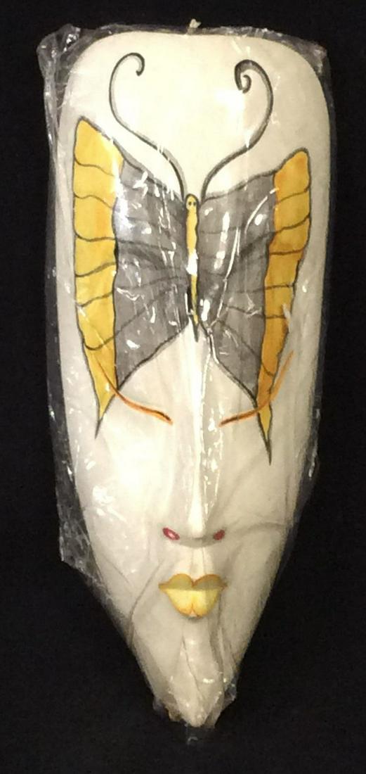New in Pkg, Handmade Wood Face Mask Decor: Elongated masked with large butterfly acting as the eyes. Hand carved and hand painted. In cellophane wraps. Wired to be hung. Measures 15 x 6.5 in. Wall Decor, Harlequin Mask, Butterfly Clown Mask, W