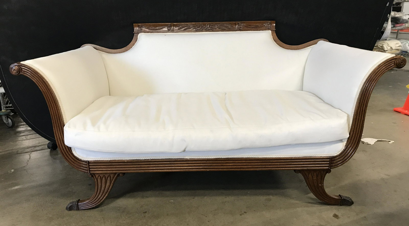 Vintage Paw Foot Upholstered Loveseat: Loveseat has a cream white tone. Sofa has carved wooden frame and paw style metal feet. 60 inches long 32 inches wide 33 inches tall. Sofa, couch, loveseat, vintage sofa, living room furniture. 6