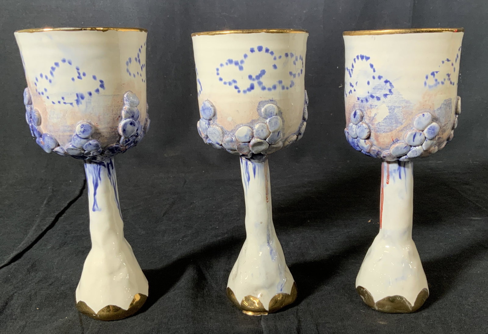 Set 3 Antique Ceramic Goblets: Set 3 Antique Ceramic Goblets, inscription to base partially illegible reads ‘74’, gold and blue painted design, two goblets measure 7 3/8 inches tall, other measures 7 1/2 inches tall, larger gob