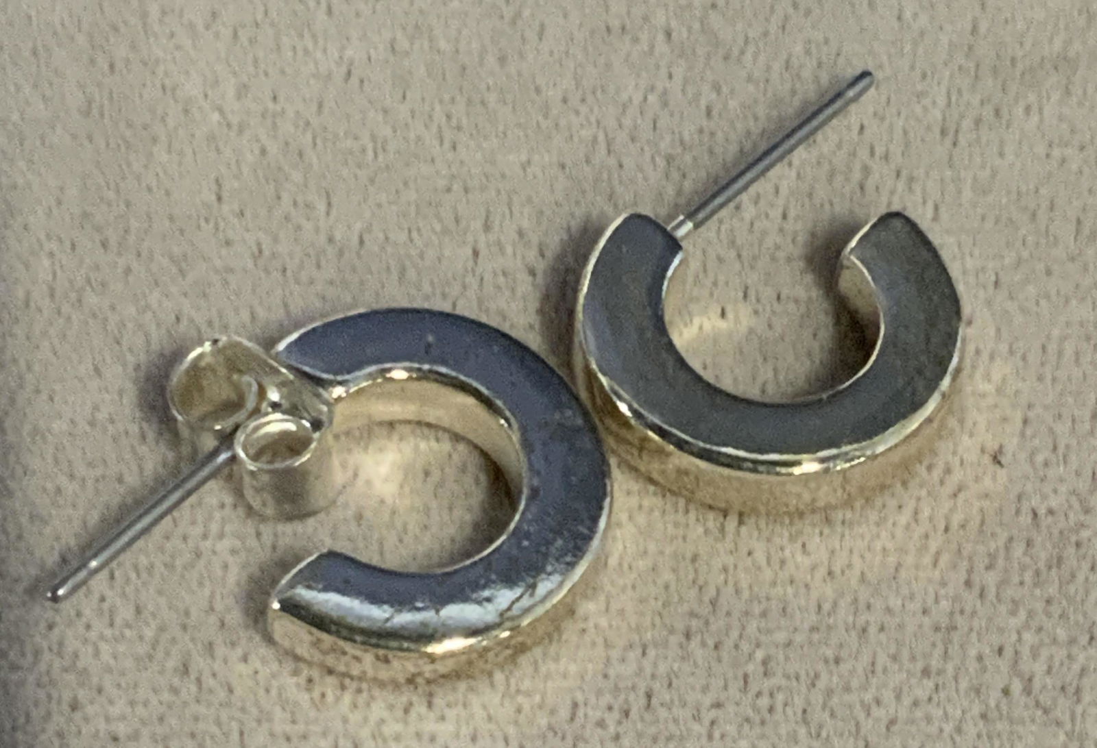 C- Shape Silver Toned Stud Pierced Earrings: Post and butterfly back earrings, one missing butterfly back. C shape. Silver toned metal. 1/2 in wide. Costume jewelry, Pierced Earrings, Ladies Fashion Jewelry, Ladies Accessories, Earrings, Jewelry