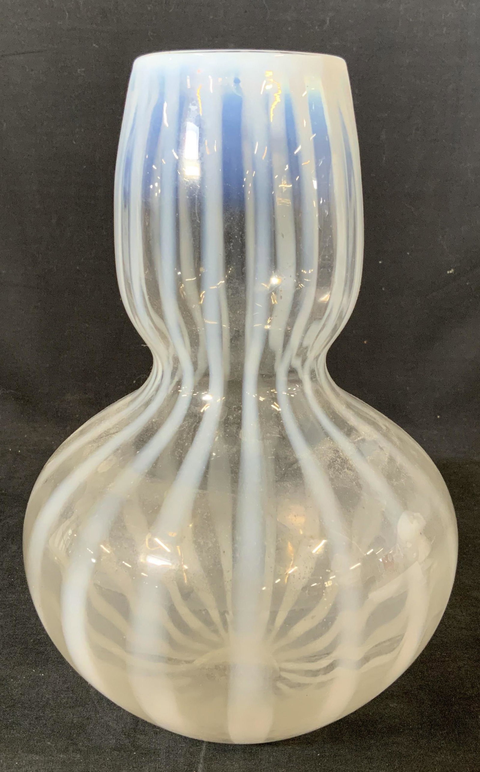 Striped Opalescent Art Glass Vase: Hand crafted, Striped glass vase, no apparent inscriptions or stamps, measures 10 5/8 inches tall x 6 5/8 inches in diameter at widest point, chip to rim but overall in good condition, Glass vase, art