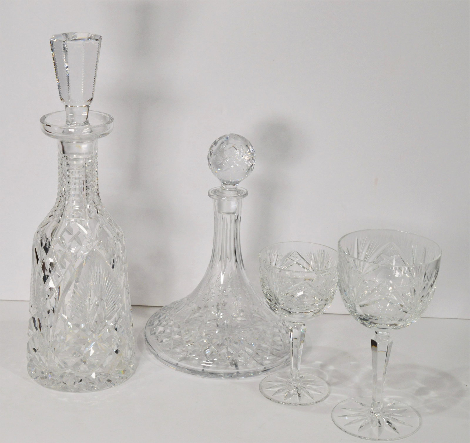 Fine Crystal Whiskey/ Brandy & Wine Decanters: Approx -Brandy 7 x 6-1/2", Wine- 10"x 4" Serve for the holidays in style with these elegant fine Crystal Beverage Decanters complete with Stoppers. Pair of bonus crystal glasses included. In very good
