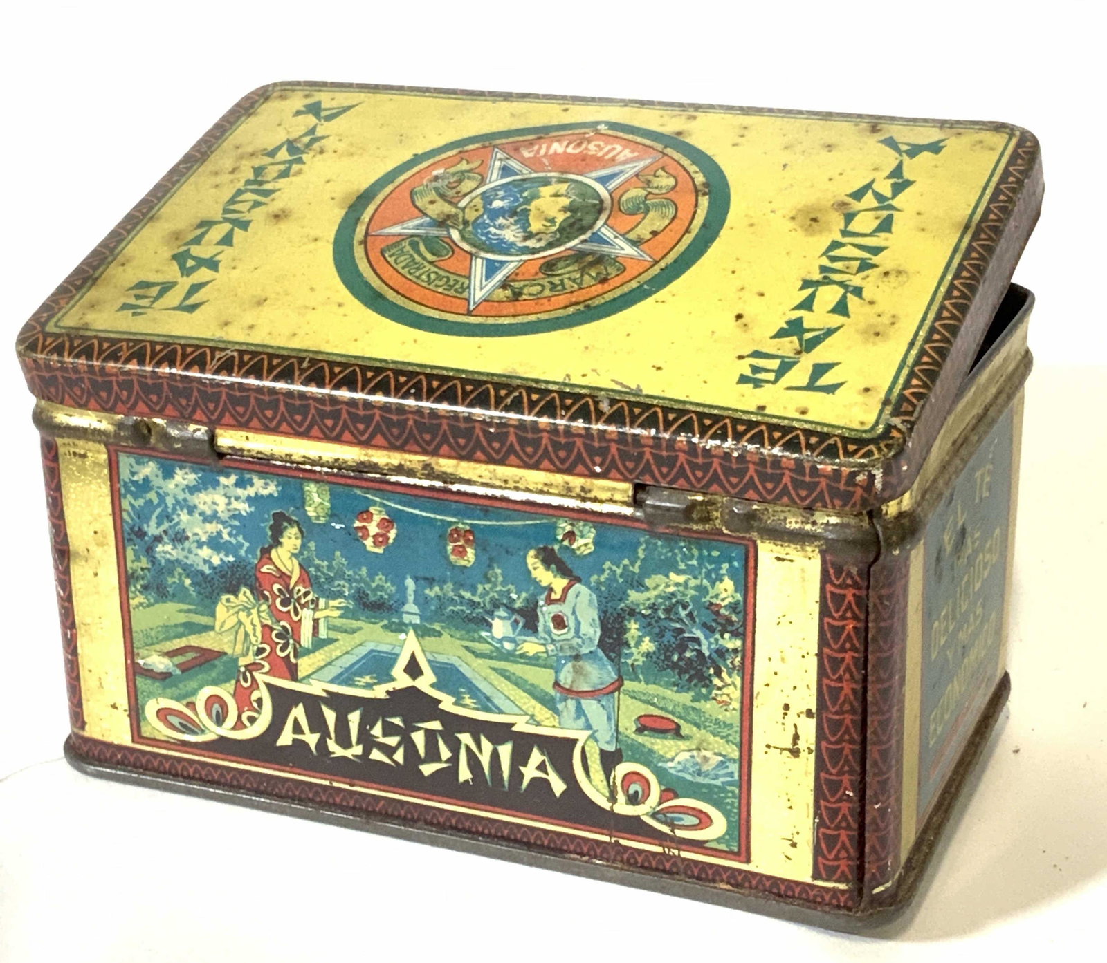 Vintage Glass Marbles in Antique AUSONIA Tin: Tea tin with Spanish writing that reads ‘AUSONIA- El Té Más Delicioso Y más Económico‘ & ‘ Unicos Imporatadores Boero Napoliy CIA. Rosario de Santa Fe. Marbles are multiple sizes with swirls