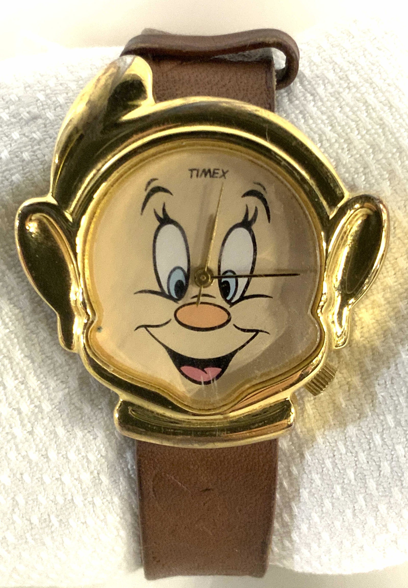 DISNEY TIMEX Dopey Wristwatch: Official Disney TIMEX watch depicting Dopey, Drawf from Snow White and the Seven Drawfs. Japan Movement. Leather strap 8.5 in. Watch face 1.5 in wide. Vintage Jewelry Accessory, Costume Jewelry, Weara