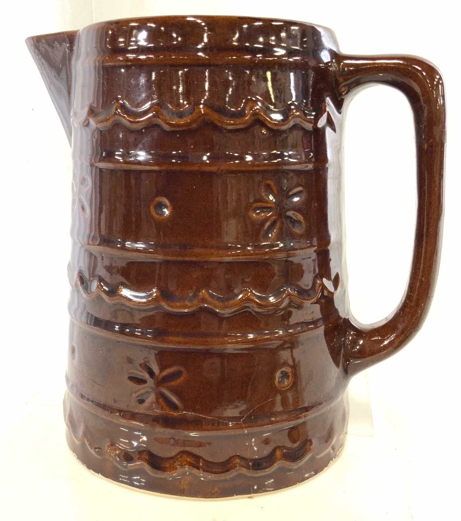 MARCREST Stoneware Glazed Pitcher, signed: Marcrest Stoneware Pitcher Large Brown Glazed Daisy Dot Pitcher/ Jug . Oven Proof stoneware, vintage, forming crack from bottom of pottery. Underside reads ‘Marcrest Oven Proof stoneware USA’ 8.25