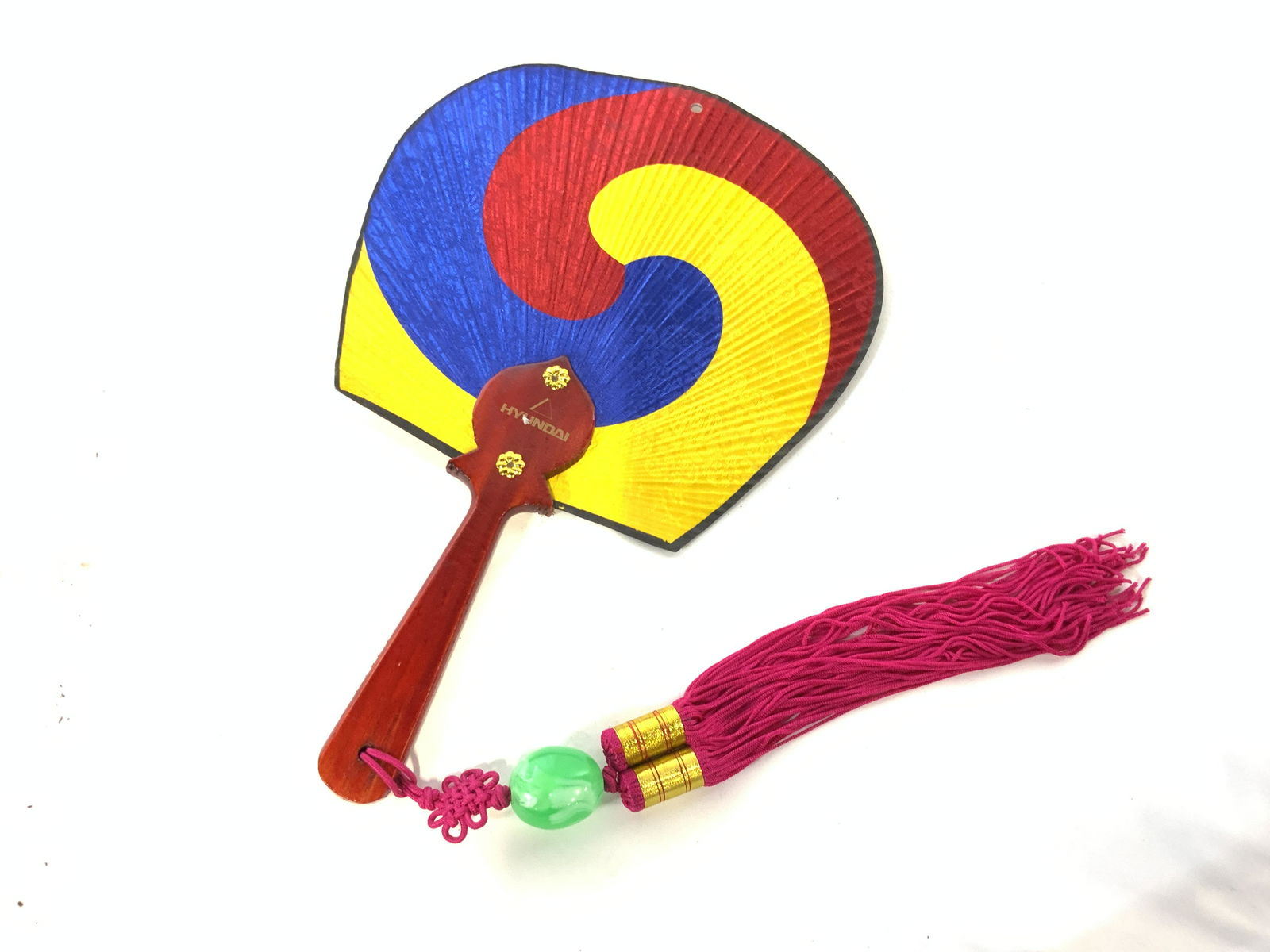 Lot 22 Far East Accessories: Lot 4 packages leather hair ornaments with stick pin. Set 12 straw coasters. Decorative Wood Camel and donkey caravan. Hand held fan with wood handle and bright pink tassel. Pair musical castanuelas,