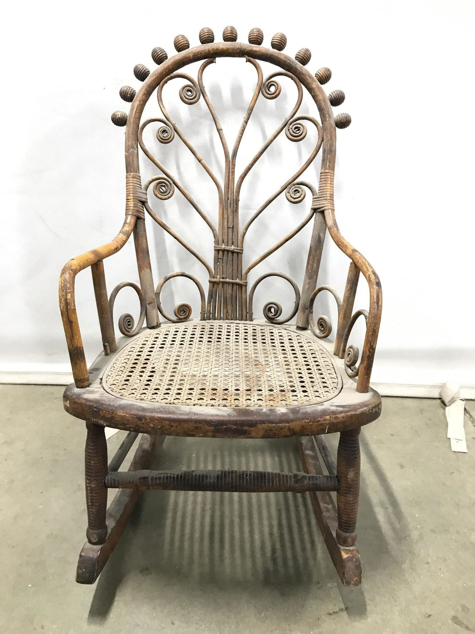 Antique Caned Children’s Bentwood Rocking Chair: Pair of antique ladder back chair, seats are rush. Stool is upholstered, Snake skin pattern, possibly vintage. Largest pieces measure approx 31 inches H, 13 inches W, and 11 inches deep. Wear is consi