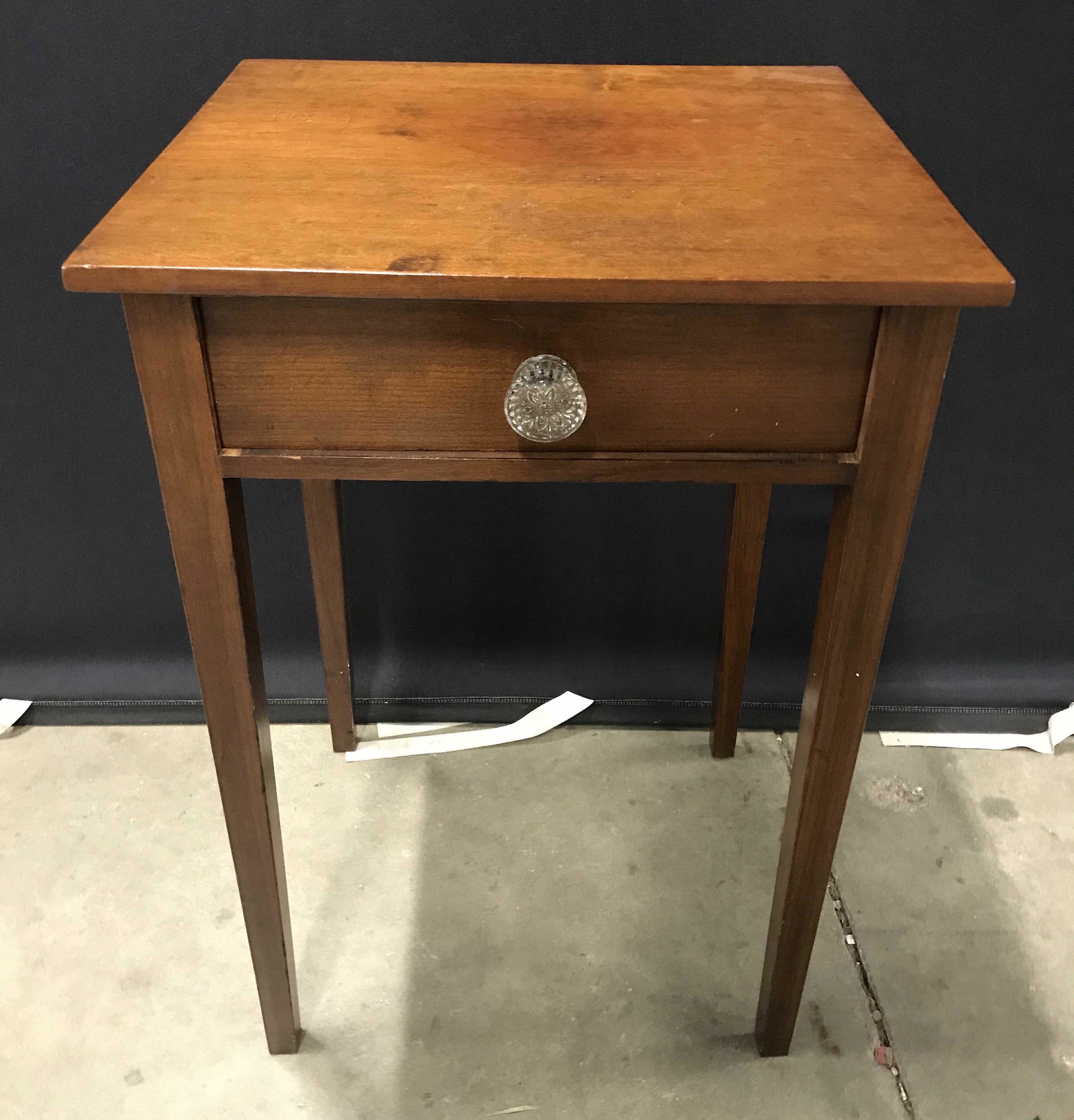 Antique Carved Wood Side Table: Antique Carved Wood side table. Drawer pull is cut glass, drawer joints are dovetailed. Measures approx 26 inches H, 17.25 inches w, and 15.75 inches deep. Wear is consistent with age and use. Side ta