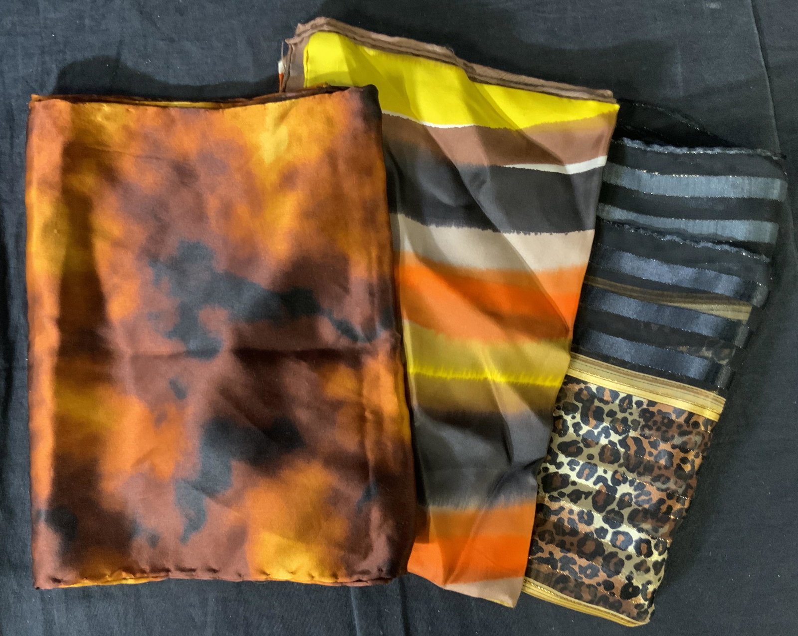 Lot 3 Women’s Scarves, LIZ CLAIRBORNE & Others: Lot 3 Women’s Scarves, LIZ CLAIRBORNE & Others, label to one scarf reads ‘Made in Korea Casca Scarfs 100% Silk Dry Clean Only RN 64135’ and ‘Liz Clairborne’, watercolor like design to two sc