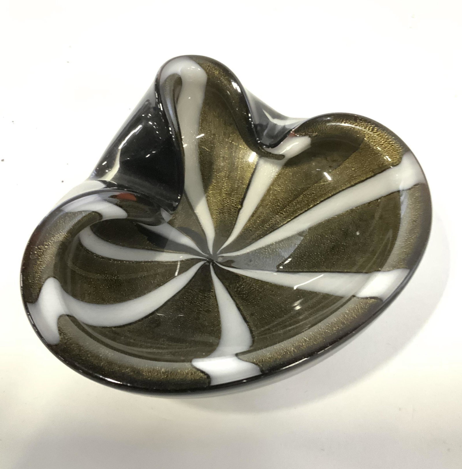 Gold & Black Pinwheel Art Glass Bowl: Heavy And thick walled art glass, bowl/dish. Smooth Glass With gold and white ‘pin wheel ‘ pattern on black glass. 6.5 x 6 in. 2.5 in ht. Art Glass, Studio Glass, Colored Glass, pinwheel design Gl