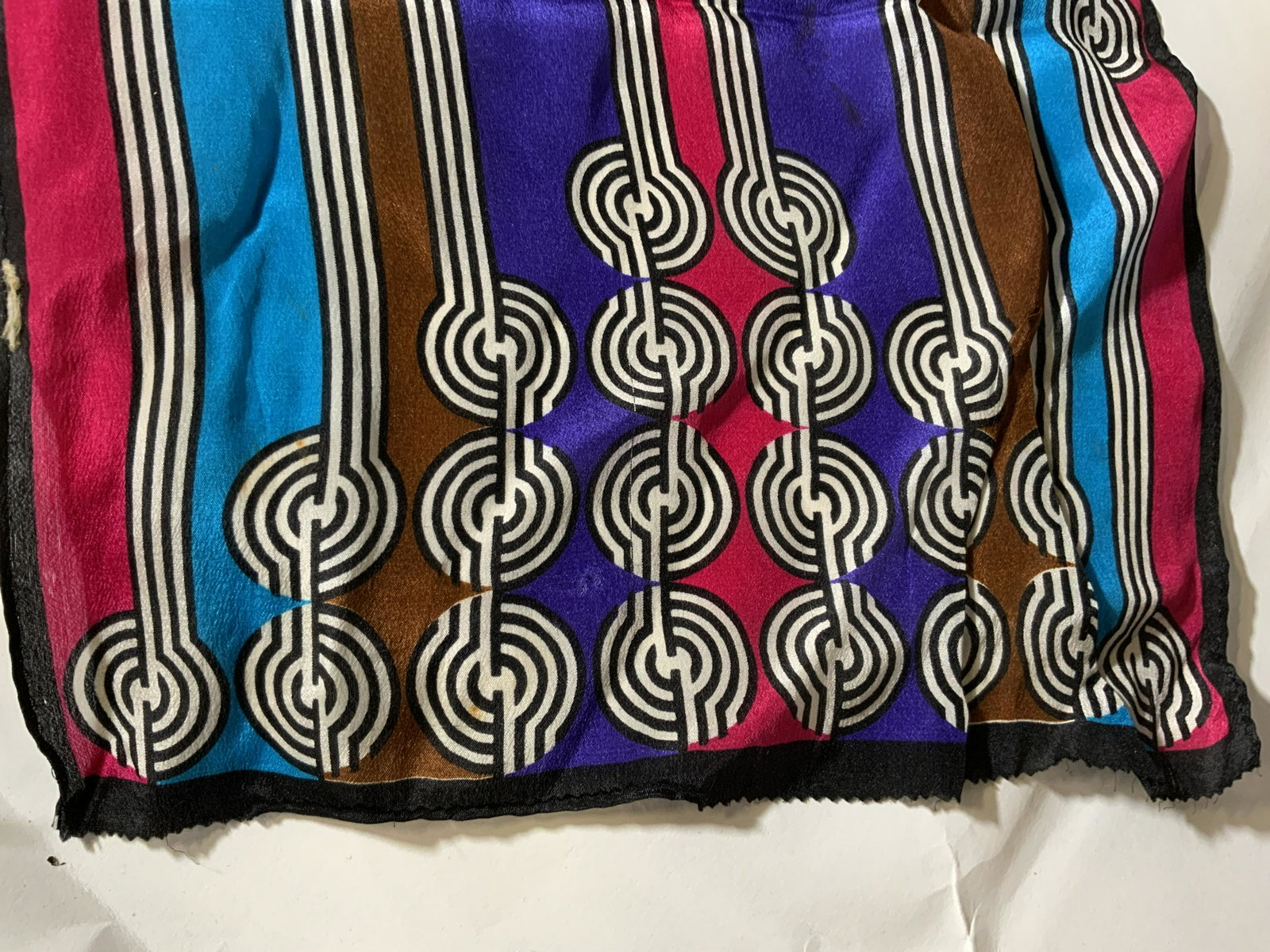 Vintage Signed HARVÉ BENARD SILK SCARF: Bold Deco pattern black and white stripes outlining aqua, purple pink & brown colors. Signed harvé bernard in lower case. Lightweight silk. 11 x 54 in. A couple areas of light wear to fabric. Signed 
