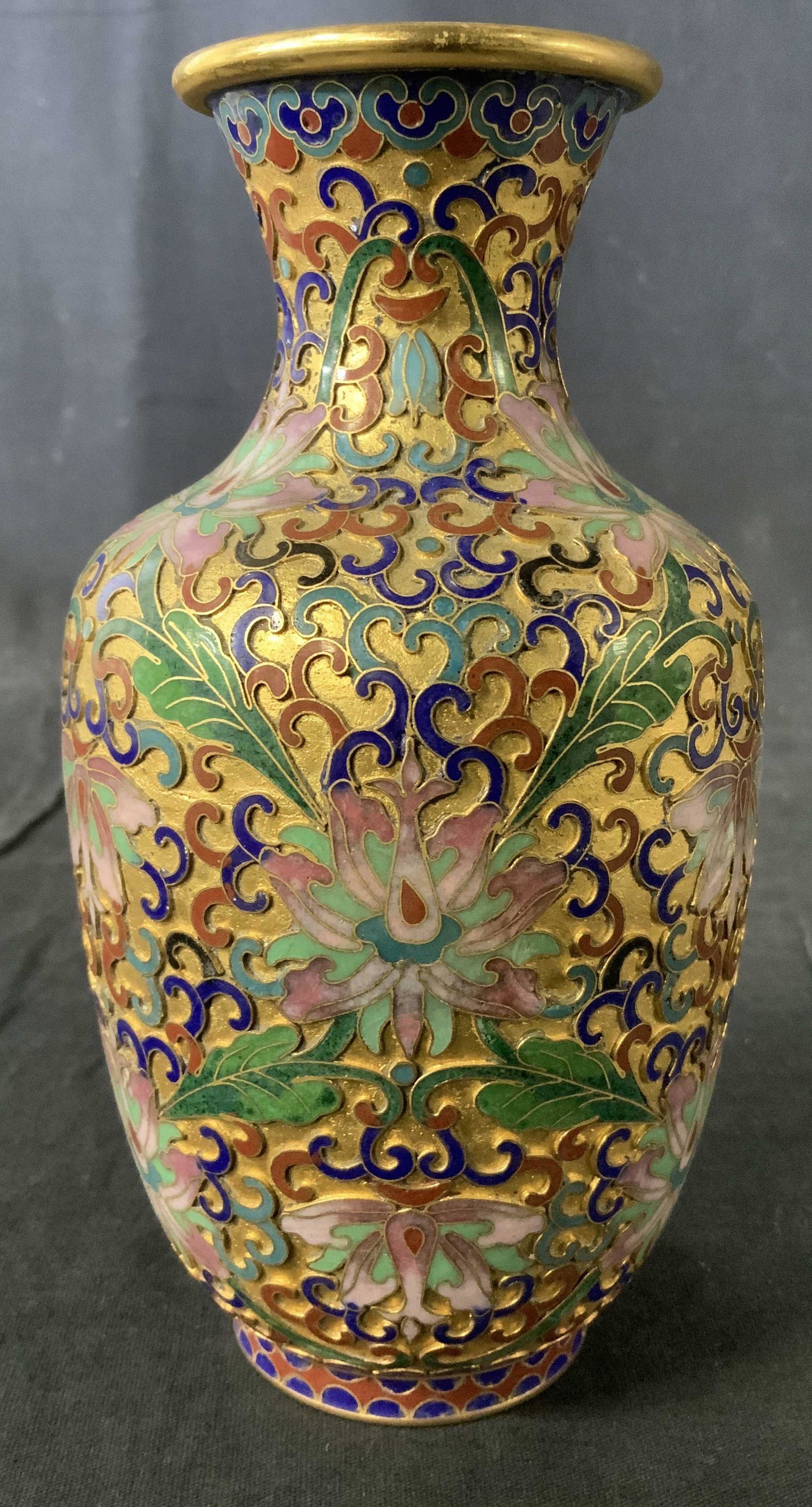 Asian Enameled Champleve Flower Vase: Enameled Champleve Flower Vase, no apparent inscriptions or labels, intricate multi colored floral design to exterior, Measures 7 inches tall x 2 1/8 inches wide at base, Some surface wear but overall