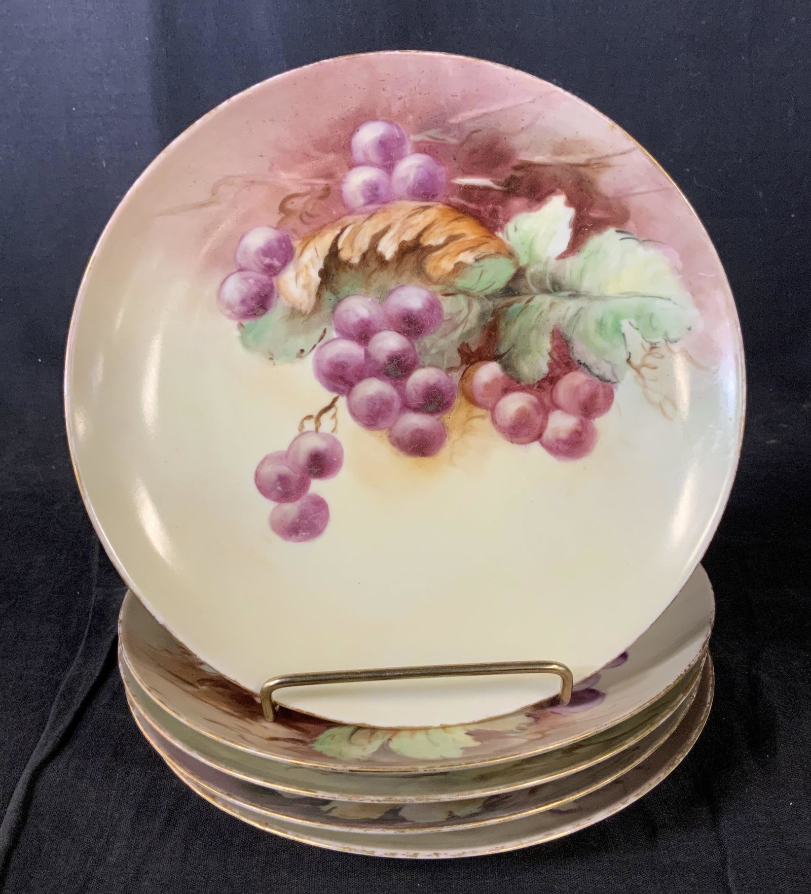 Set 5 M & Z Austria Plates: Set 5 M & Z Austria Plates, stamp to base reads ‘M & Z Austria’, design features grapes and leaves, all measure 7 3/4 inches in diameter, some surface wear but overall in good condition, Set, m & 