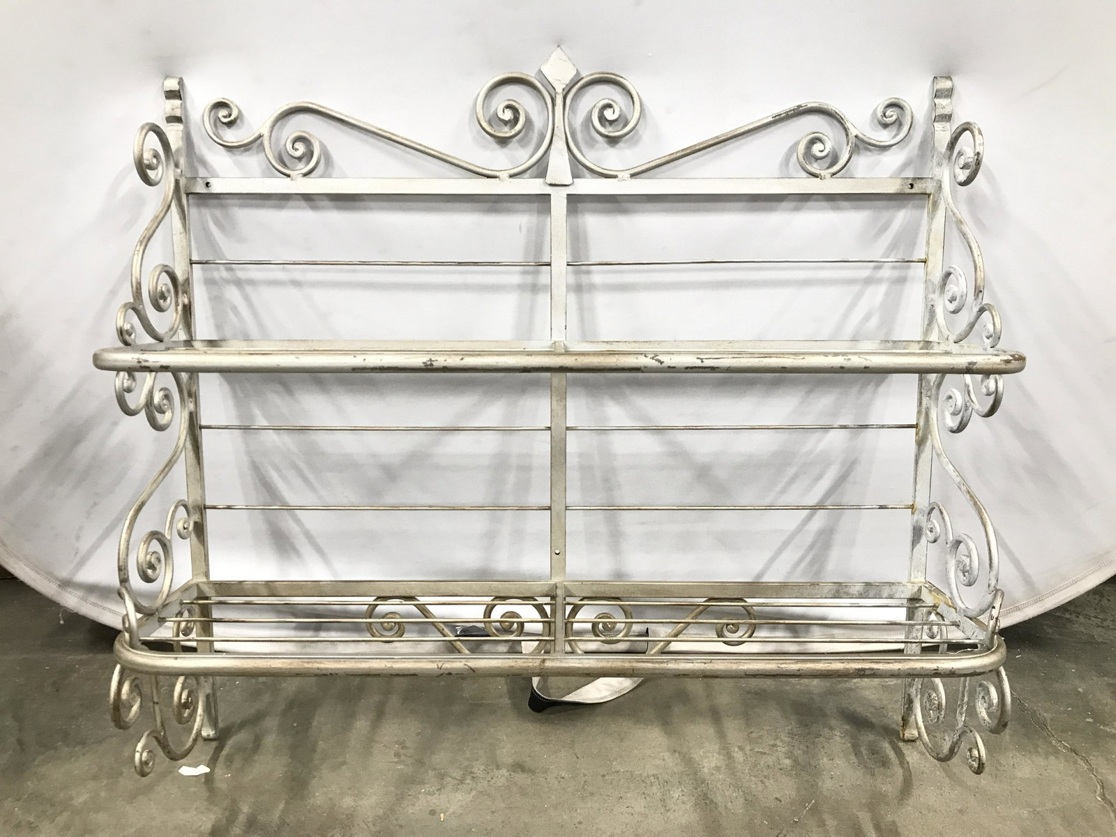 Silver Toned Metal Wall Mount Planter Shelves: Planter rack is vintage and metal. Piece is silver toned. Rack has 2 shelves. Piece has s curve structure detail. Planter shelves, planter rack, metal planter rack, wall mount planter rack, vintage pl