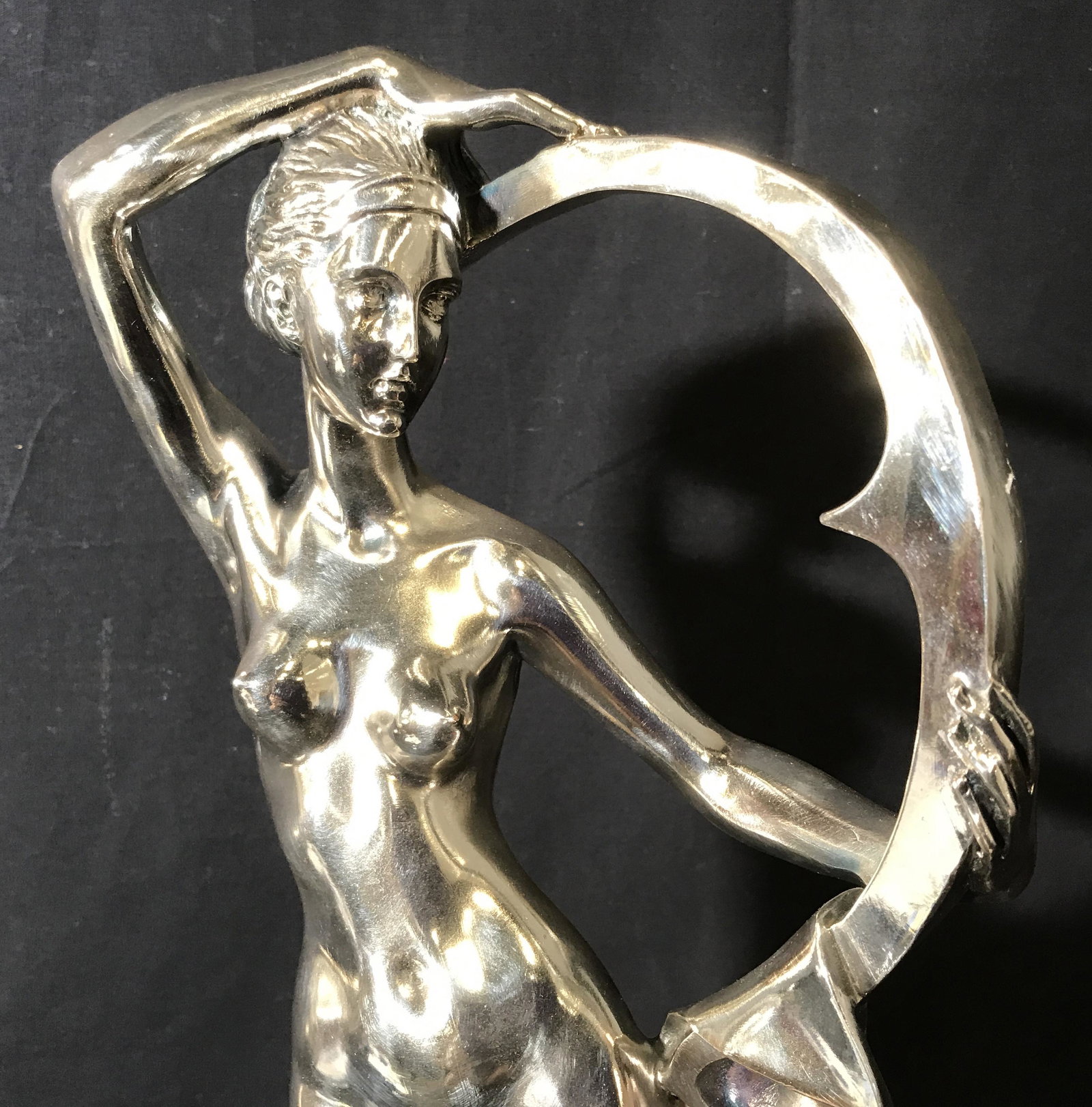 J GARCIA Silver Overlay Female Art Nude Statue: J. Garcia Silver Overlay Female Nude Art Deco Statue, plaque to base reads ‘J.Garcia’, subject a female nude with an abstract shape that she holds, on a white veined black marble base, property of