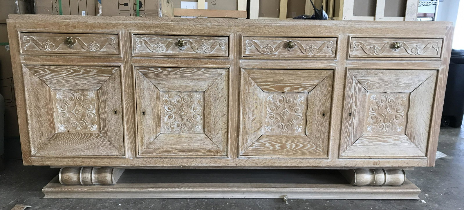 Vintage Carved Wooden French Buffet: Buffet is tan toned And wooden. Piece appears to be custom made. Piece contains 4 drawers each with carved wooden s scroll detail & gold toned knob style handles. Each drawer has hand dovetailing. Pie