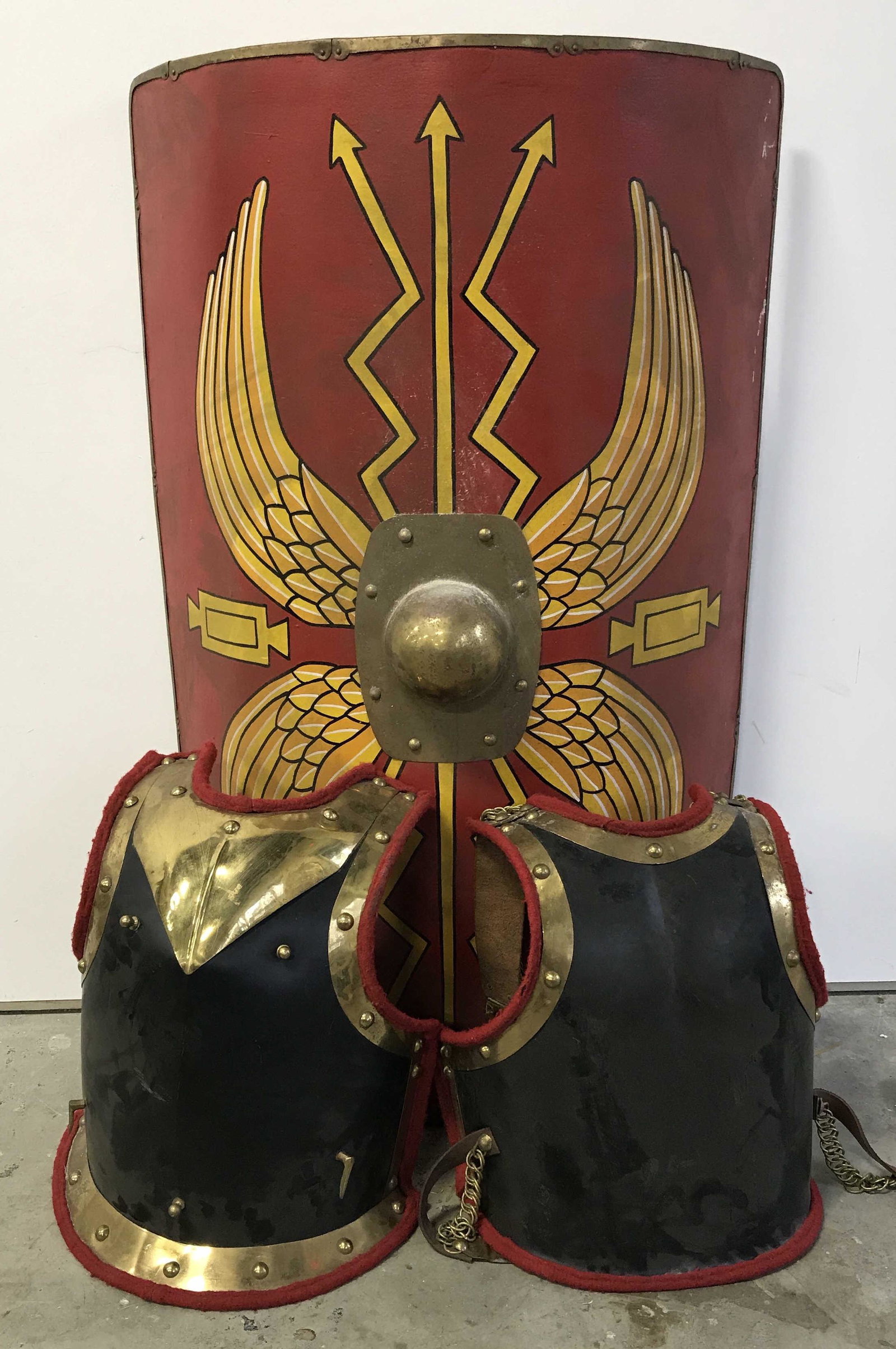 Scutum Shield & Medieval Cuirass: Scutum Shield and medieval cuirass, scutum Shield painted as a traditional Roman Legionaires' Shield a Design typically from the beginning of the Roman Empire, medieval style Curiass with gold toned m