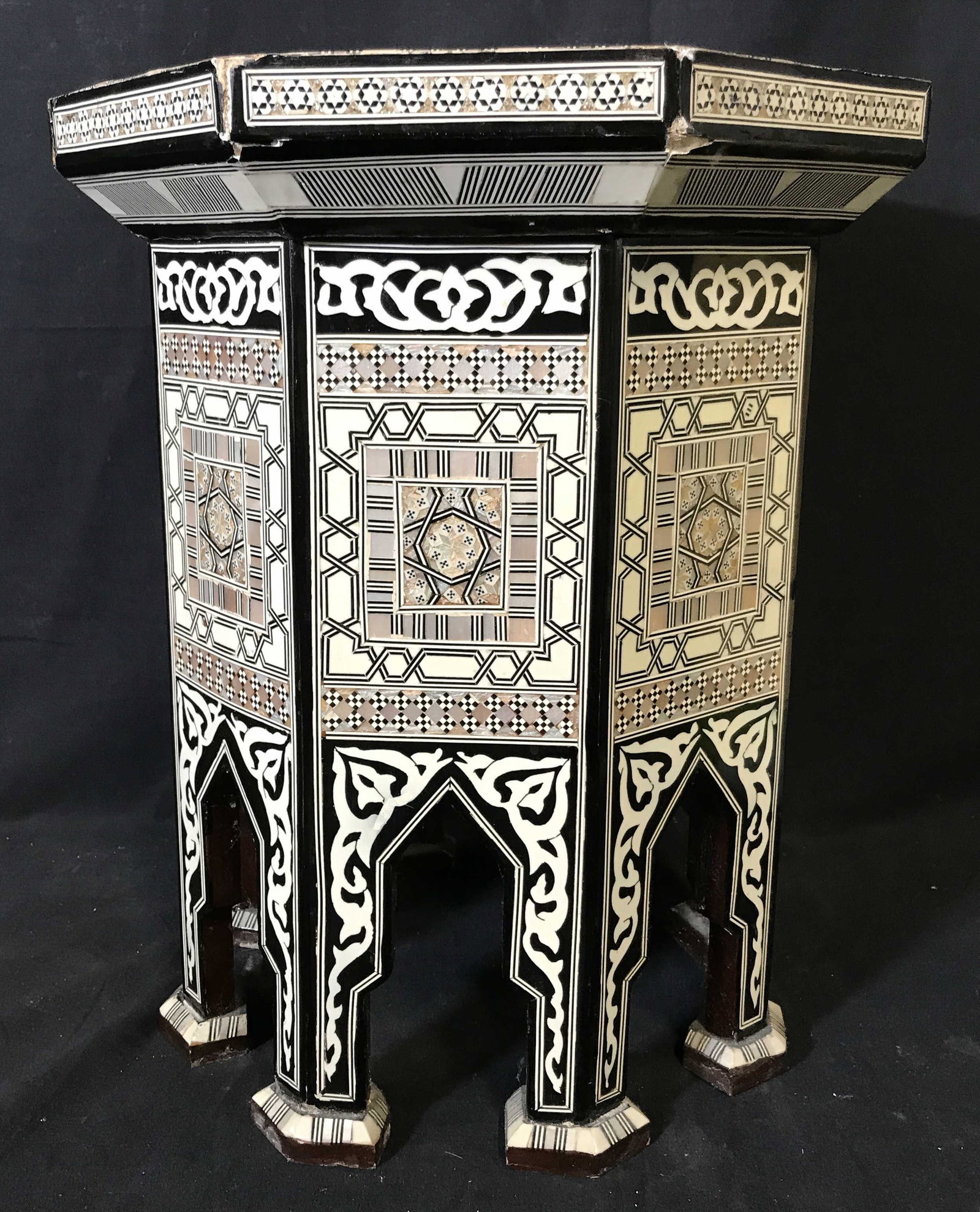 Moroccan Wood & Pearl Inlaid Pedestal Box: Moroccan Wood & Pearl inlaid pedestal box, made with Moroccan style arches and designs, box is held up on 8 legs, where the black and white designs are absent a dark rich lacquered wood can be seen, l