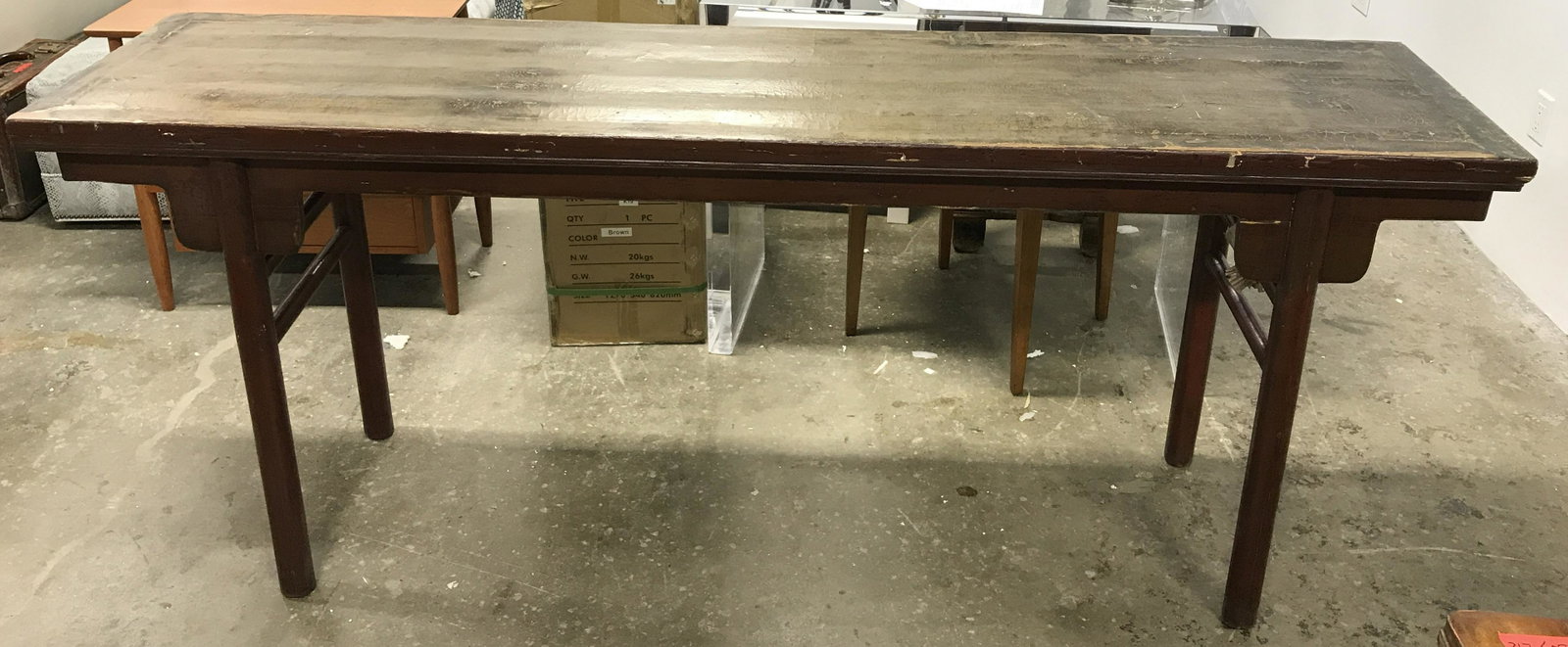 Antique Wood Console Table: Antique console table, crafted from carved wood. Wood is cherry toned. Tabletop finish has degraded to a degree. legs on each side are connected by horizontal stretchers. Measures approx 34 inches H, 