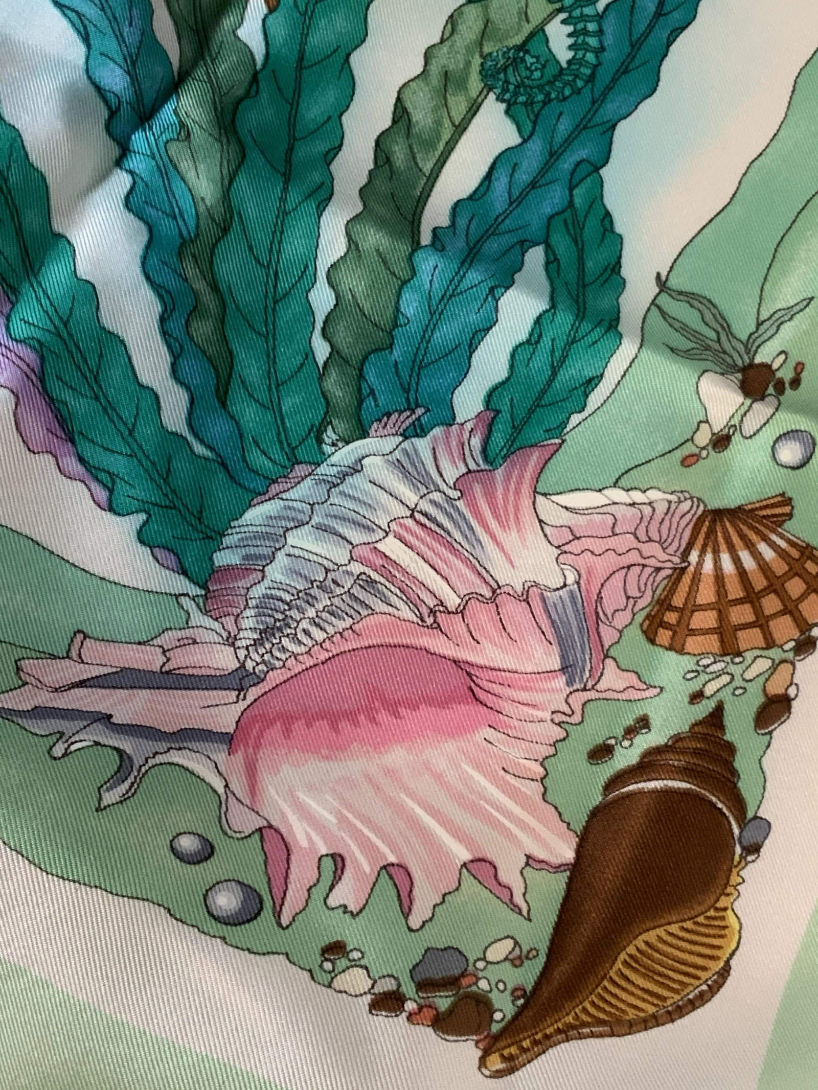 GUCCI Artist Signed Colorful Maritime Scarf: Colorful Maritime motif scarf with aquatic life and pearls throughout the center. Sea foam green boarder. Fish, seaweed, coral, and pearls are a variety of colors. Near the boarder it reads: GUCCI on 