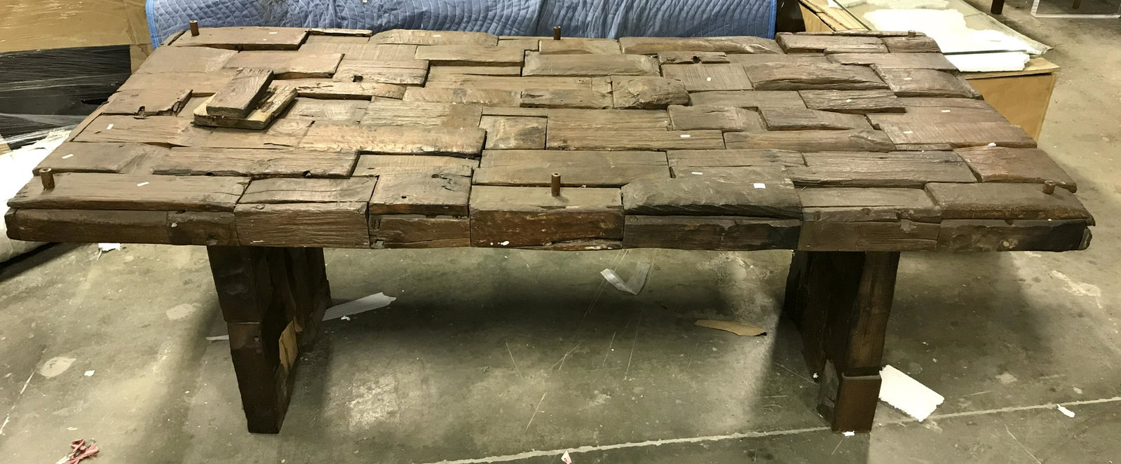 Wooden Mosaic Dining Table, Indonesia: Wooden dining table. Wood shingles are arranged as a mosaic. Several pegs rise from the tables surface. Several shingles are labeled and read as MADE IN INDONESIA. possibly handmade. Measures approx 3