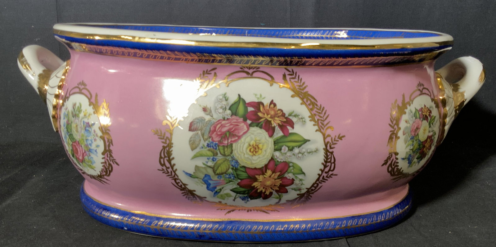 LIMOGES Louis XV Oversized Porcelain Centerpiece: Lady Pompadour pink with colorful rose cartouche enwrapped by gilded laurels. Deep blue upper, lower, inner and outer rims with neo -classical leaf pattern. Stamped underside in gilt under glaze, read