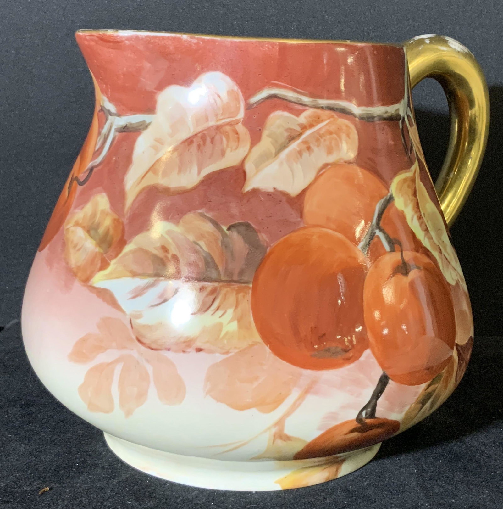 B & H LIMOGES Signed Antique French Cider Pitcher: Possibly antique hand painted fine bone China footed cider pitcher. Hand painted peaches in bunches and singles hanging from branches. Autumnal colors. Gilt line work around rim of the pitcher and han