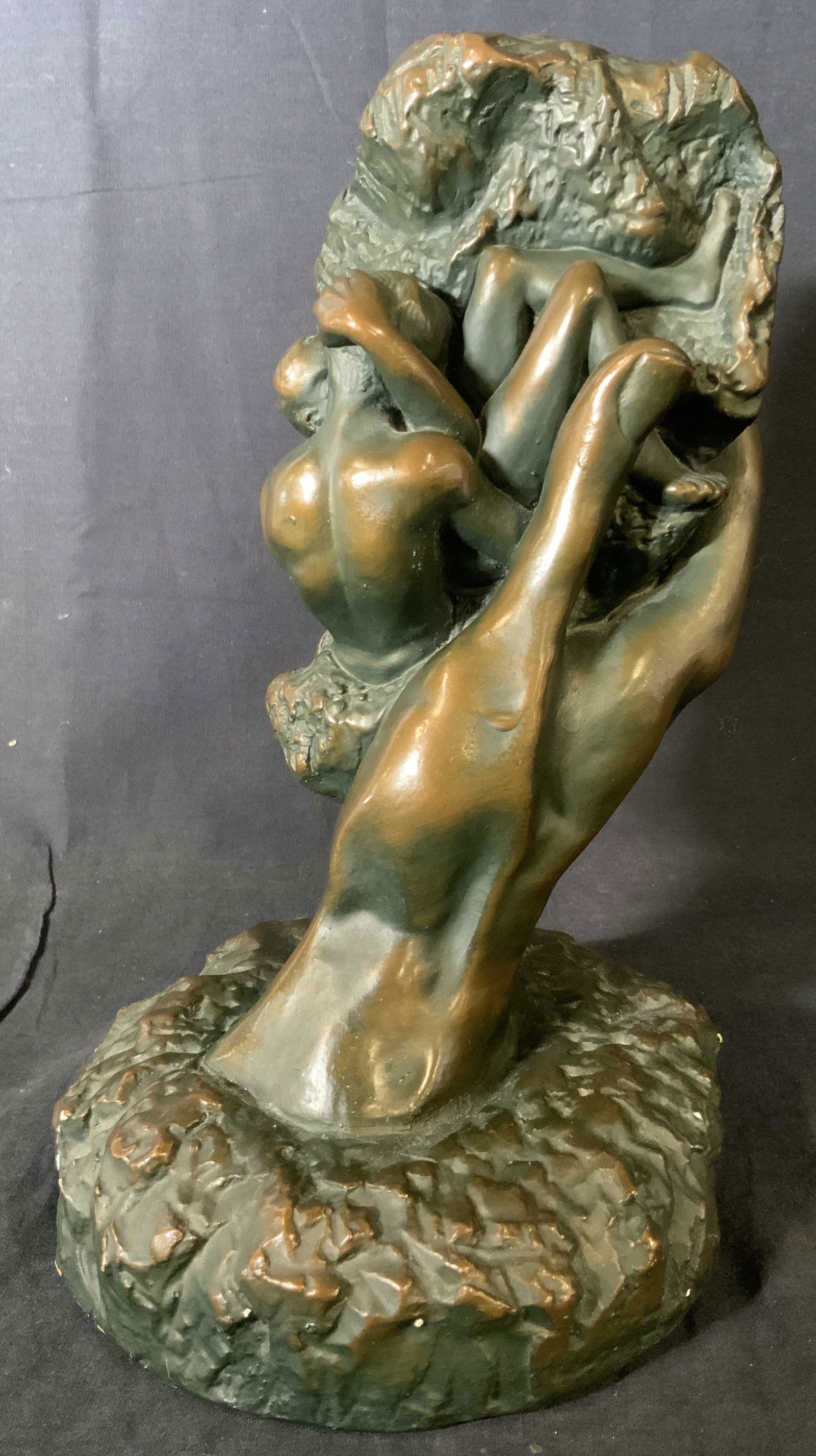 AUGUSTE RODIN Hand of God Fiberglass Sculpture: AUGUSTE RODIN Hand of God Fiberglass Sculpture, no apparent inscriptions or signatures, subject Adam and Eve within God’s hand, measures 12 5/8 x 7 1/8 inches wide at base, some surface wear but ove