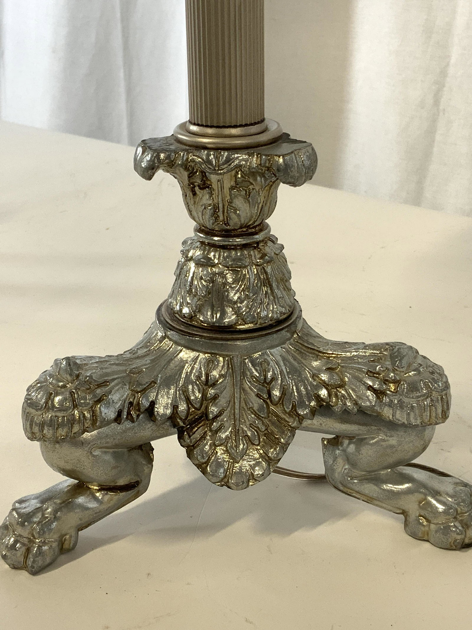 NEOCLASSICAL Claw Foot Pillar Table Lamp: Silver toned Romanesque Column Lamp with 3 large claw foot embossed metal base, typical of neoclassical leave patterns. PILLER column leads to 2 opposing lightbulbs with a metal silver toned finial. E