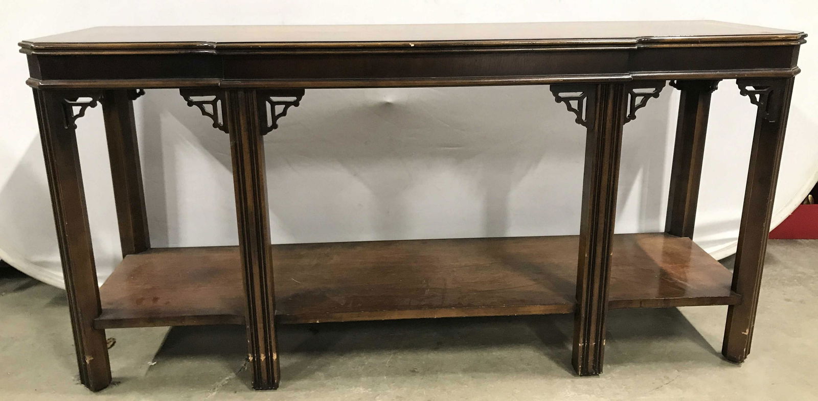 LANE Vintage Sofa Table Console Table: Underside is marked LANE. Console table is wooden. Piece has 6 carved wooden legs. Tabletop is possibly inlaid. Piece has board stretcher in between legs. Piece measures approximately 54 inches long 2