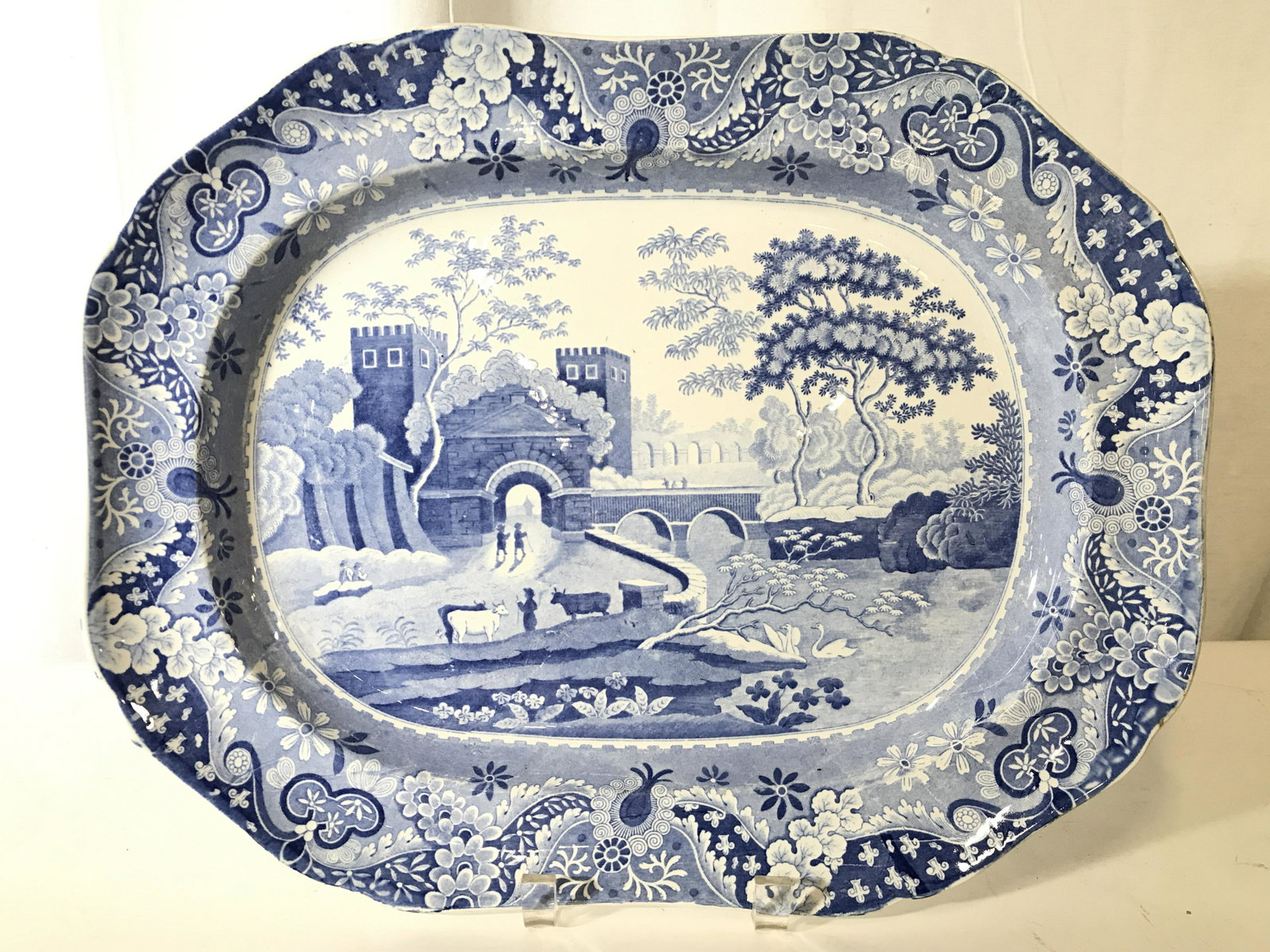 SPODE Vintage Porcelain Serving Dish: Underside is marked SPODE. Piece is vintage possibly antique. Dish is white with blue toned depiction of village scene. Piece measures approximately 16.5 inches long 13 inches wide. Spode porcelain, p