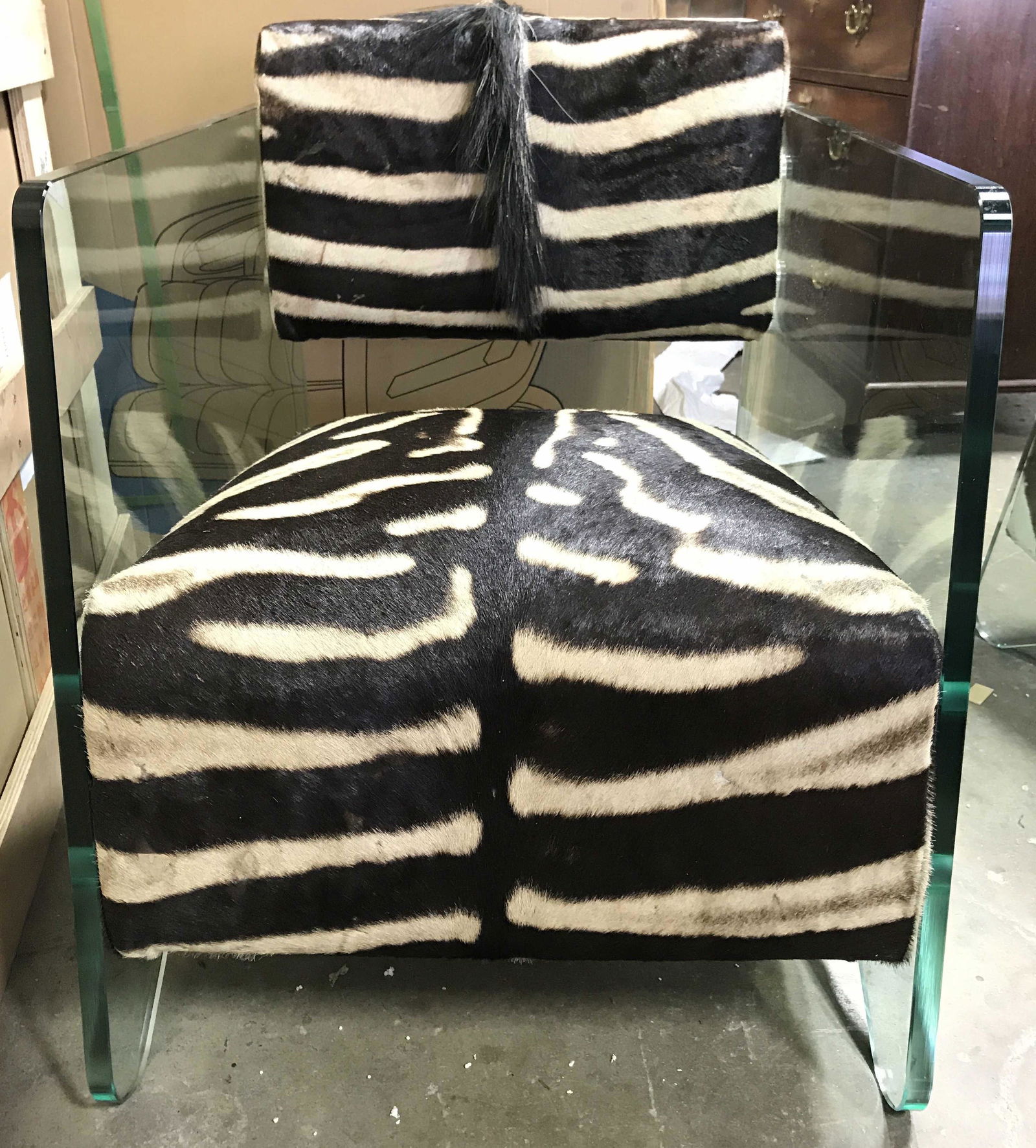 Custom Animal Hide Glass Arm Chair: Chair appears to be custom made. Chair has animal Hyde upholstery Possibly zebra. With brown & cream tones. Side of chair are thick walled glass. Measures approximately 29 tall 23 inches wide 34 inche