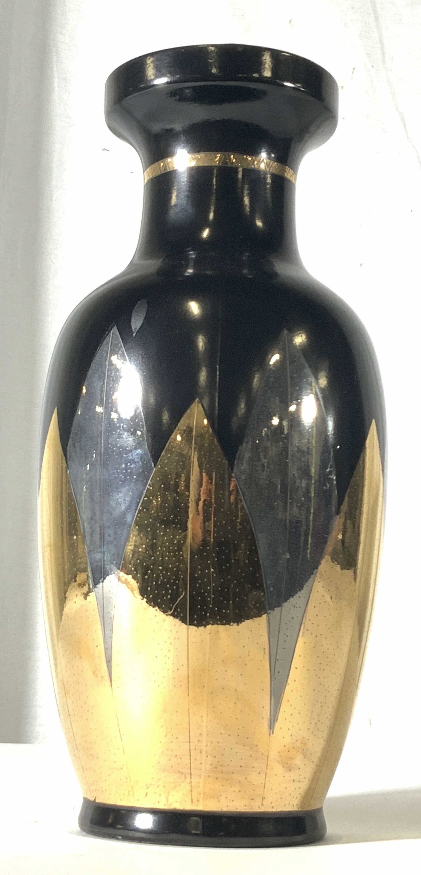 CHINA TRADERS Signed Asian Metallic Porcelain Vase: Signed black porcelain vase with mirrored geometric silver and gold tone designs. Small dots decorate each silver and gold toned design. Gilt line work along neck and rim of the vase. Underside signed
