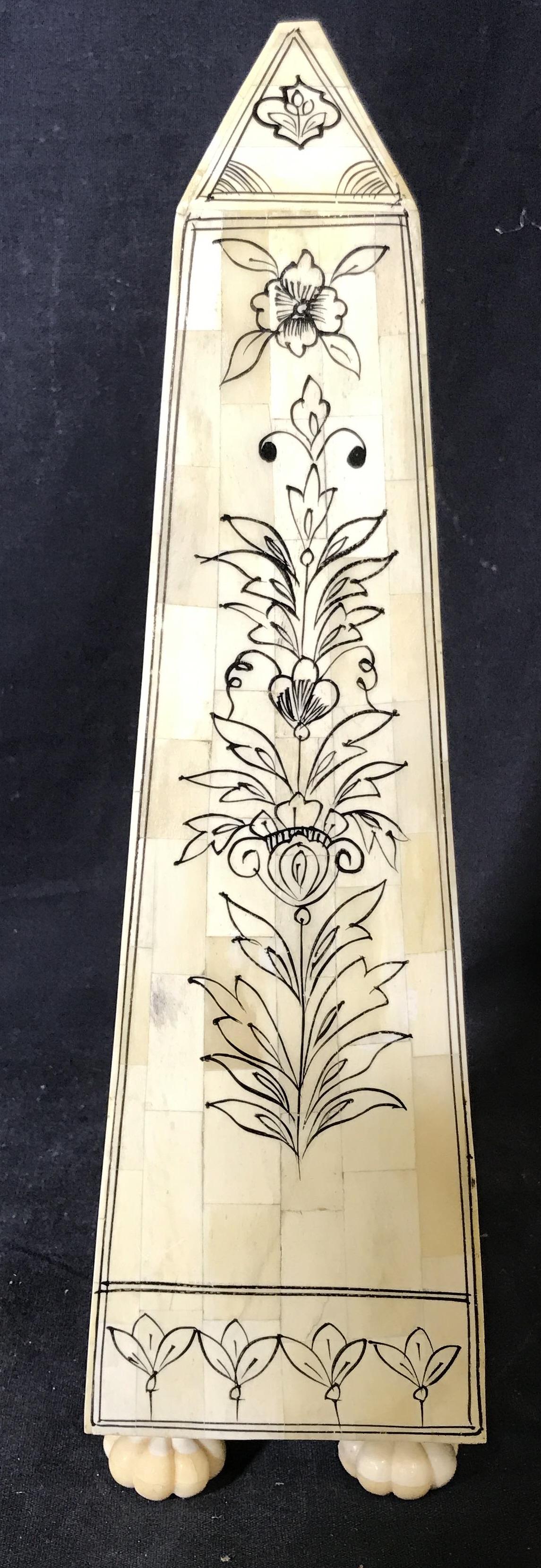 Hand Painted Alabaster Tiled Obelisk Ornament: Hand Painted alabaster field obelisk, no apparent signatures or stamps, subject an obelisk with white alabaster tiles painted with black floral designs, piece has four Florette style feet, sticker res