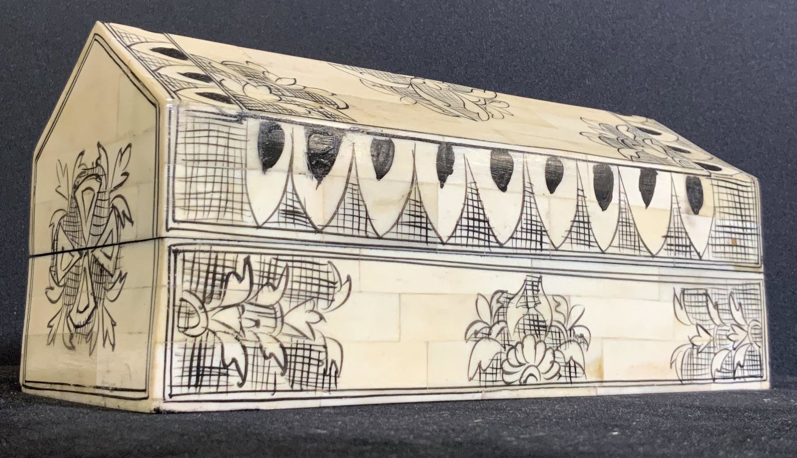 Artisan Handmade Bone Tile Trinket Box: A wooden trinket box decorated with bone tiles, and hand painted with unique floral designs. The trinket box is lidded with metal hinge hardware. The box fastens shut with snap closure. Interior of bo