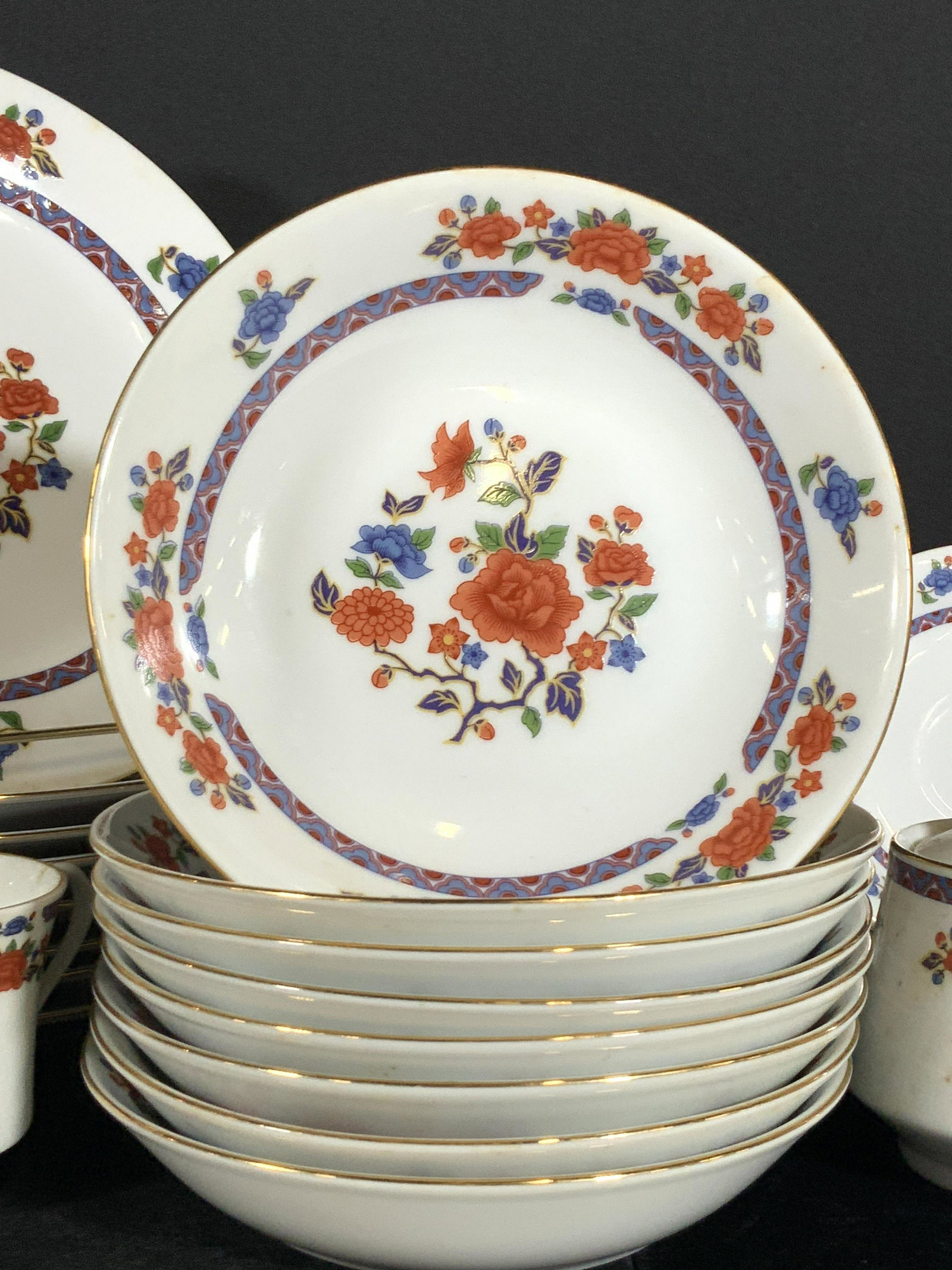 Set 43 CROWN MING Fine China Dinnerware: A set of dinnerware with 8 dinner plates, 8 teacups, 8 saucers, 1 serving plate, 1 serving bowl, 8 smaller plates that can be used as dessert plates, 8 bowls, and 1 lidded sugar vessel. The plates are