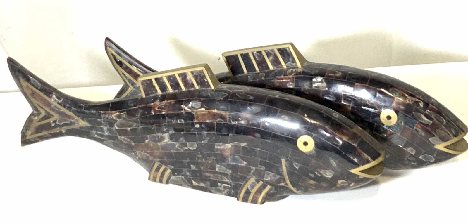 Pair MAITLAND SMITH Tessellated Stone Fish: Two hand made tessellated stone tile fish with metal accents. Some tiles are lustrous. Underside is soft textile. Underside reads: Hand Made in Philippines Designed by Maitland Smith Ltd. Approx. Heig