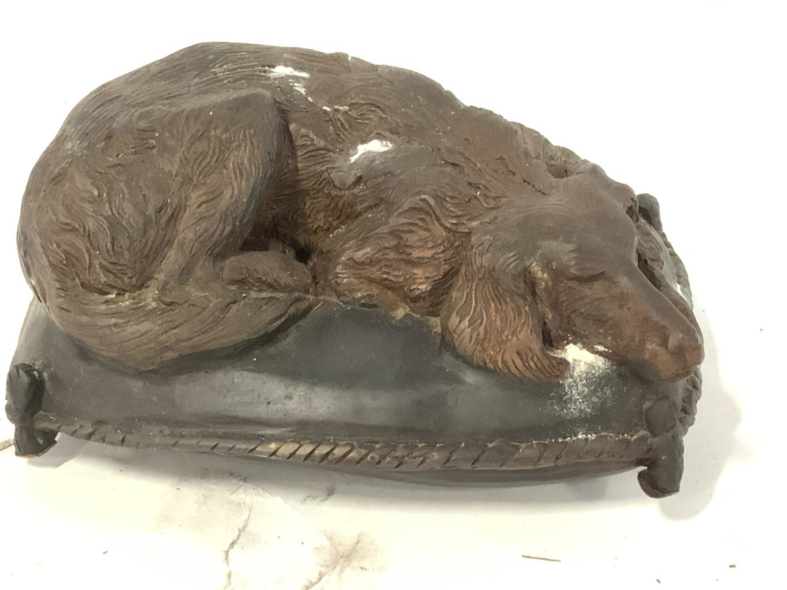 Etched Bronze Golden Retriever Dog Figural: Solid Bronze sculpture of dog laying on bed pillow, sleeping. ( possibly a golden retriever) . Weighted piece, possibly vintage. Has felted padded circles on verso. 6.5 in. L, 4.25 in. W, 3.25 in. Ht.