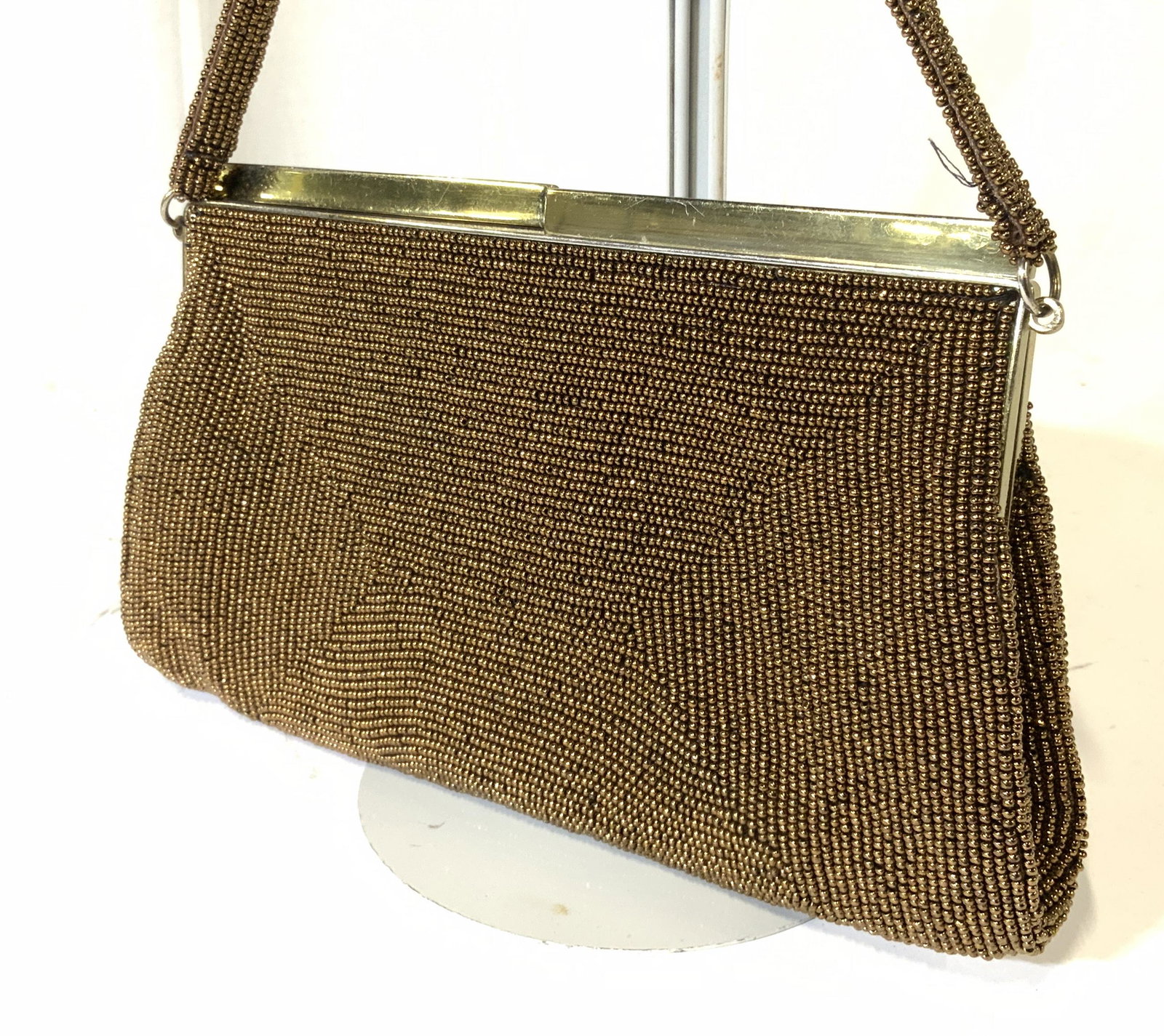 DELILL HANDMADE Bronze Seed Bead Handbag, Japan: This beaded Scroll and floral pattern is made with monochrome bronze seed beads, including strap, satin interior lining with sewn in designer label, reads ‘ DELILL Handmade in Japan’. Possibly vin