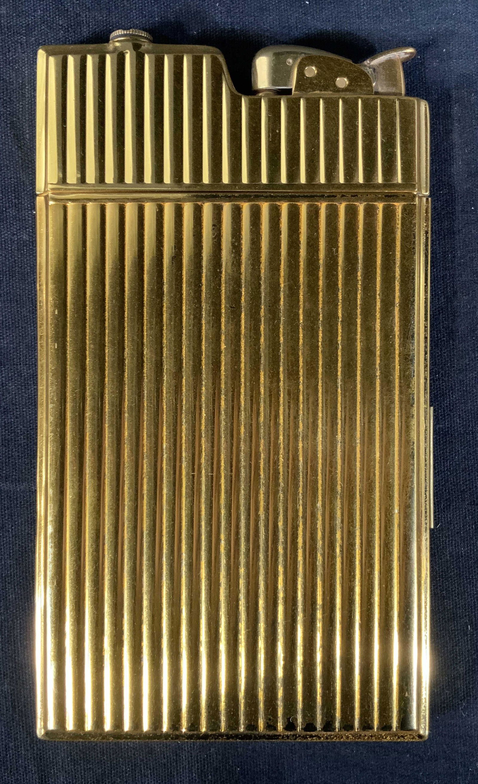 Vintage EVANS Cigarette Case & Lighter: Vintage EVANS Cigarette Case & Lighter, inscription to interior reads ‘Evans’, Inscription to cap reads ‘Evans Fuel’, and ‘Evans US Patent RE19028’, measures 5 5/8 x 3 1/4 inches, some sur