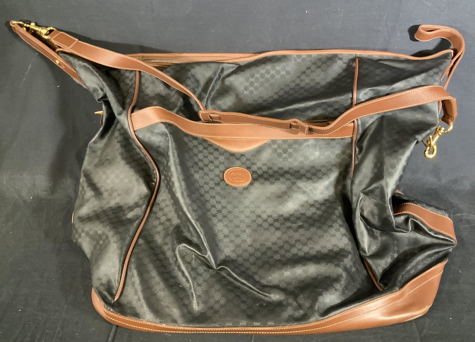 GUCCI Weekender Travel Bag: GUCCI Weekender Travel Bag, label to interior reads ‘Gucci Made in Italy’, Measures 20 x 21 5/8 inches wide at base, drop measures 17 inches. Wristlet measures 7 3/8 x 9 7/8 inches, comes with wri