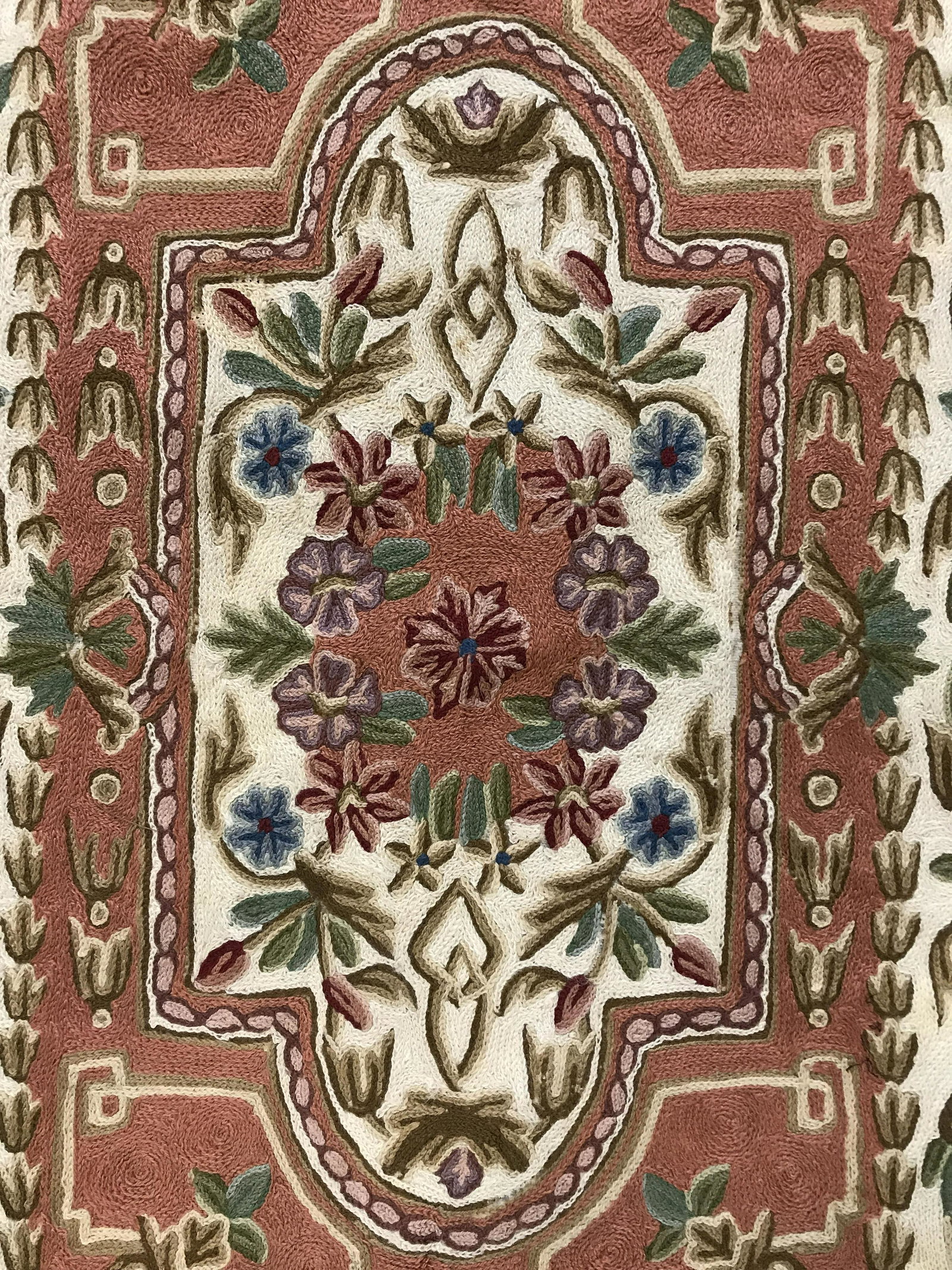 Vintage Woven Floral Area Rug: Vintage rug, decorated with an all over floral and plant like pattern. Hand made chain stitched pattern, canvas backed. Possibly handmade. Measures approx 37 inches Long, 24.5 inches W. Originally pro