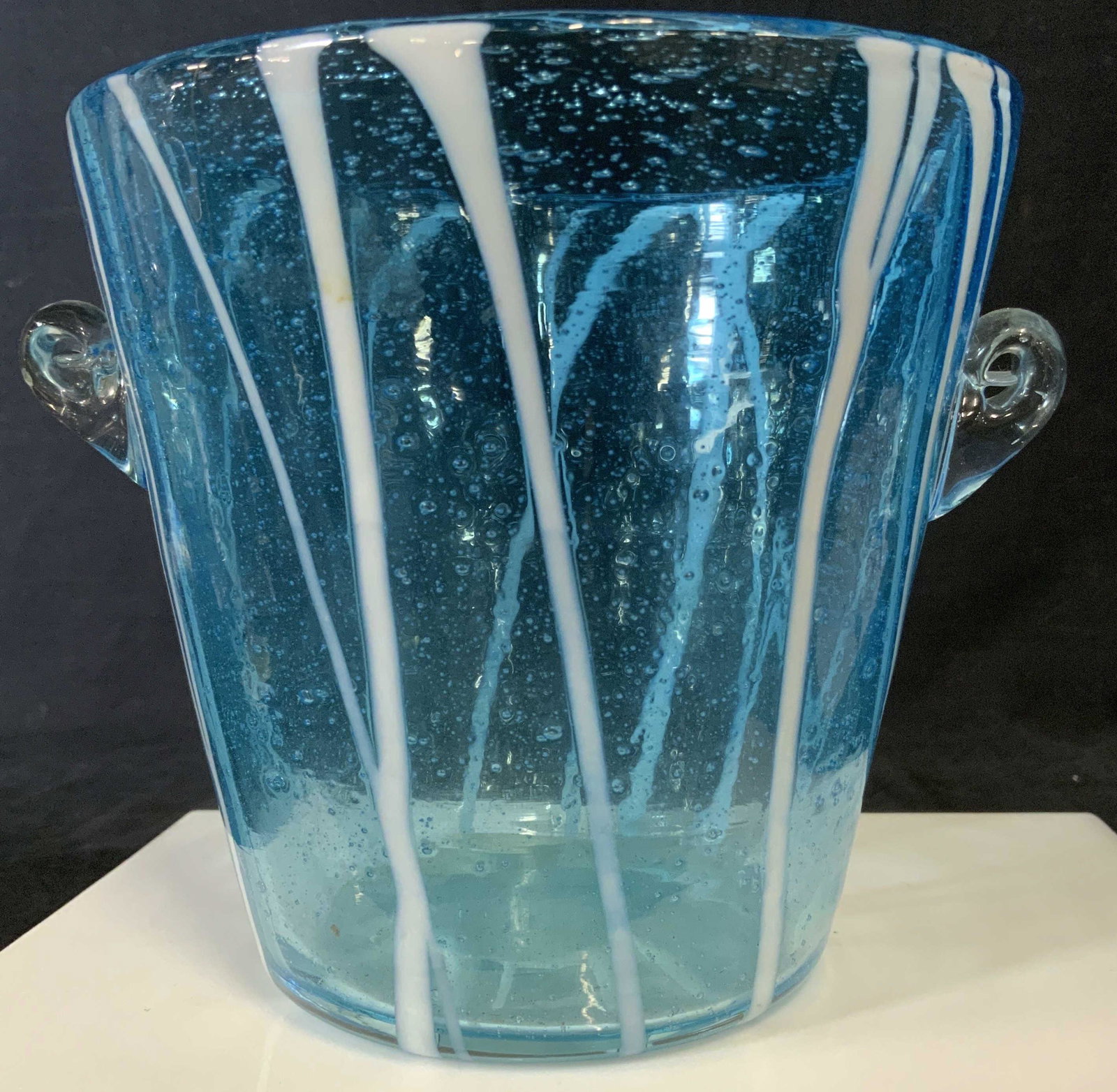 VININI HAND BLOWN MURANO Ice Bucket, Italy: Luxury Venini for DiSaronno, Venetian Caribbean Blue Seeded Art Glass with White embossed dripping stripes. Side handles. Thicker walled glass. 5.5 in diameter. Total width 6.5 in. Ht 5 in. Up cycle a